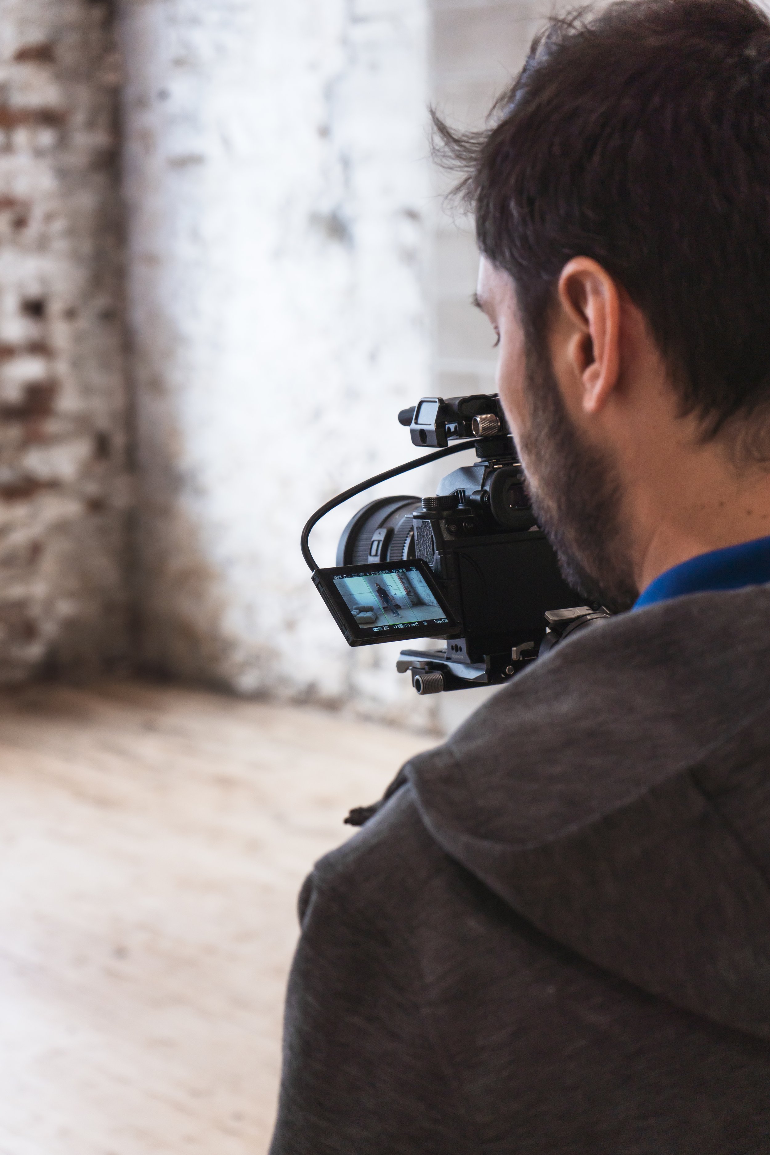 over the shoulder of a videographer from Toronto Ontario Canada while he takes his shot.