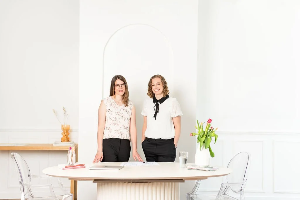 Web designer and web developer smiling at the camera