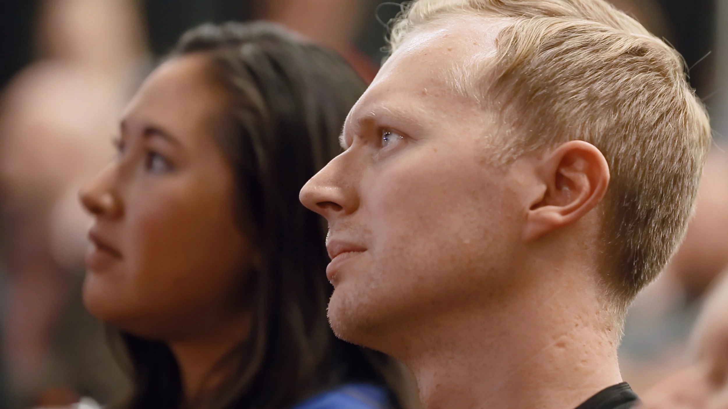 Jonas and Heather watch a match.