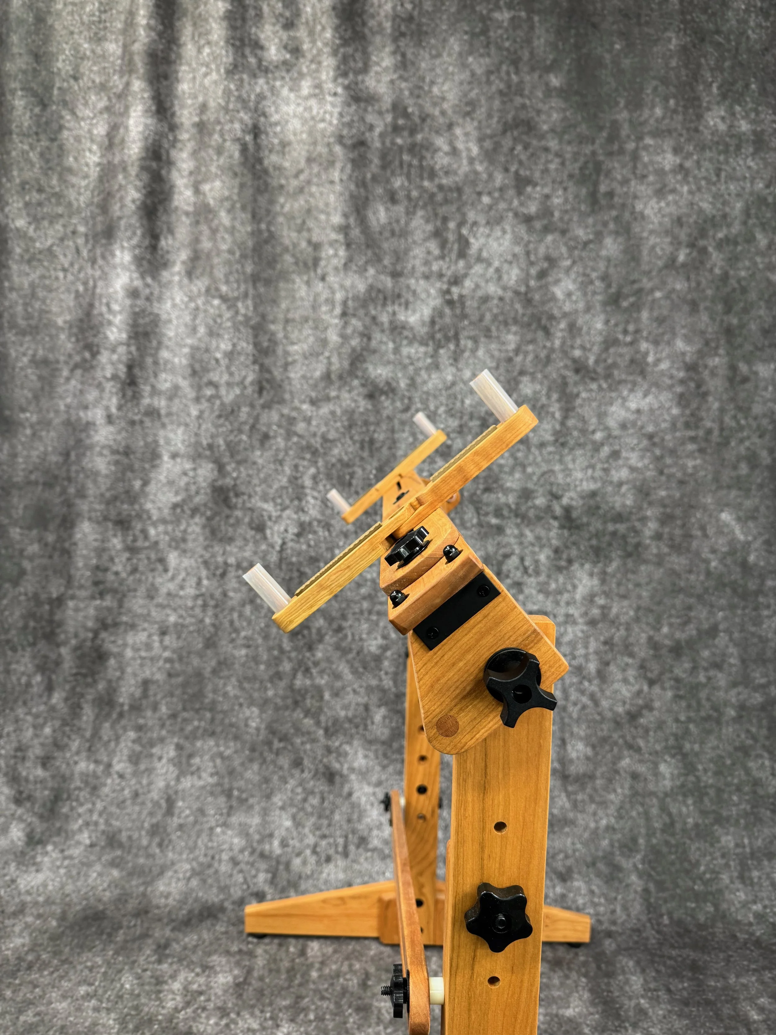 A mountain dulcimer stand, shown tilted.
