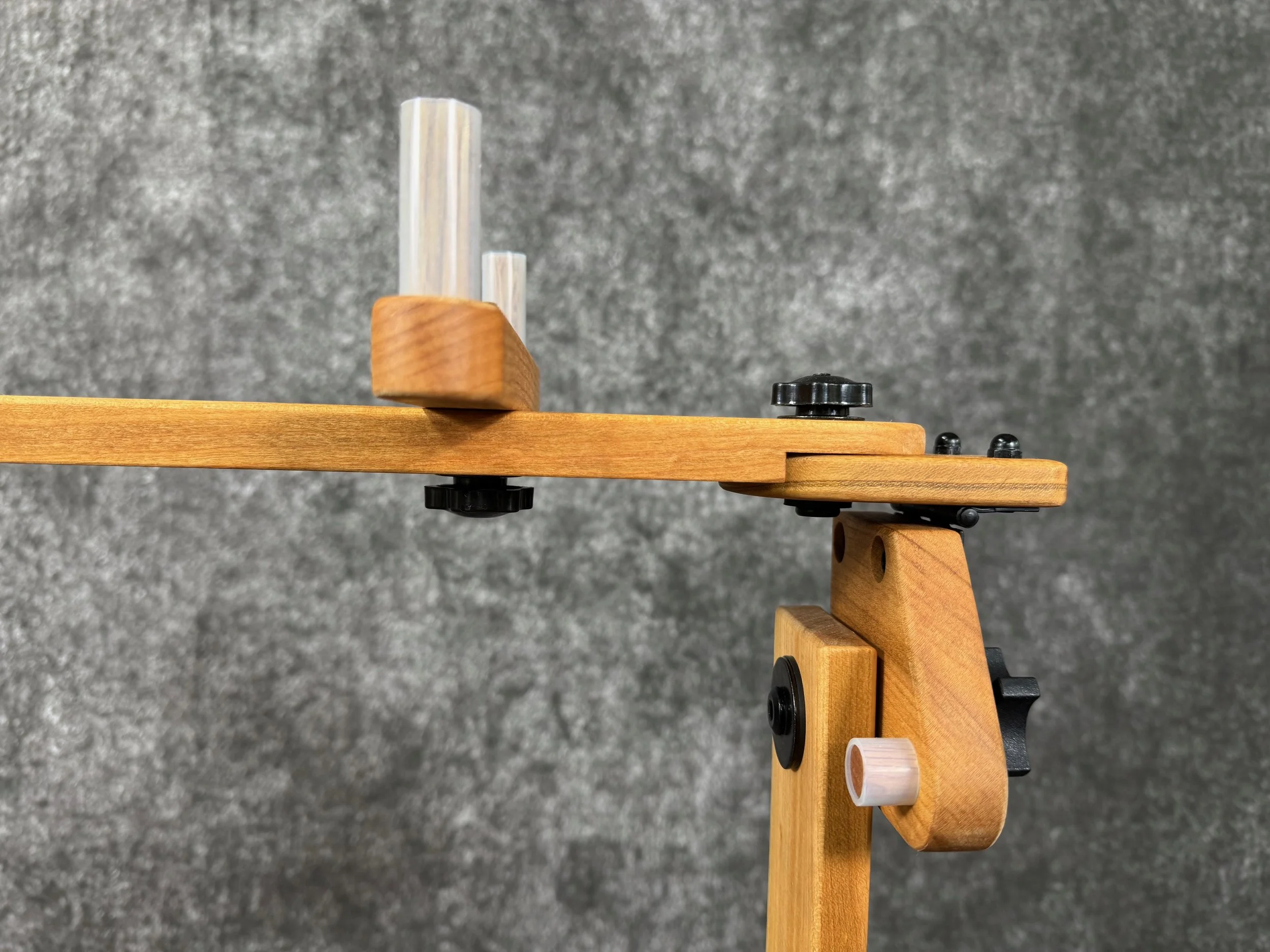 Close-up of a mountain dulcimer stand instrument brace, swivel plate, and stop-bloc.