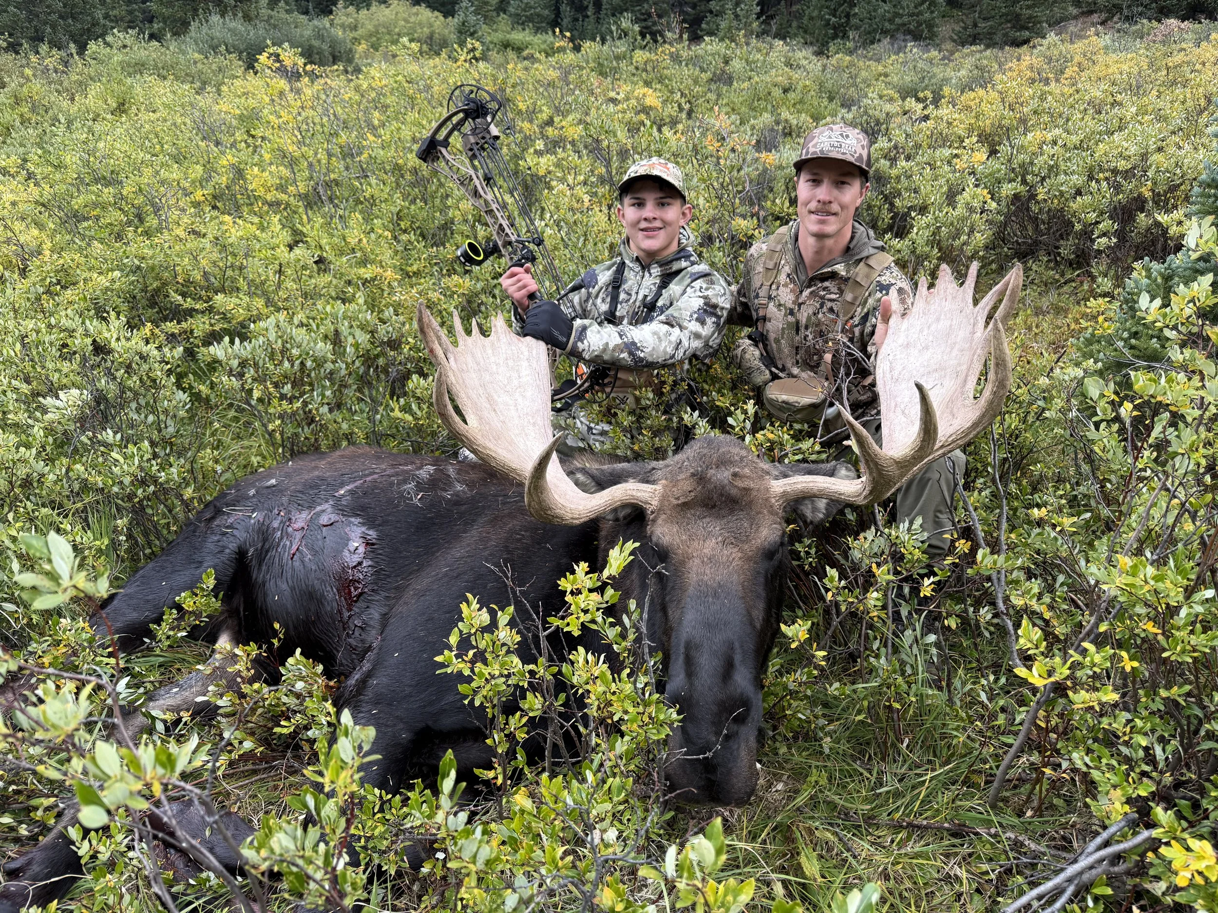 Guide Ted Benge with Colorado archery bull moose client in GMU 47
