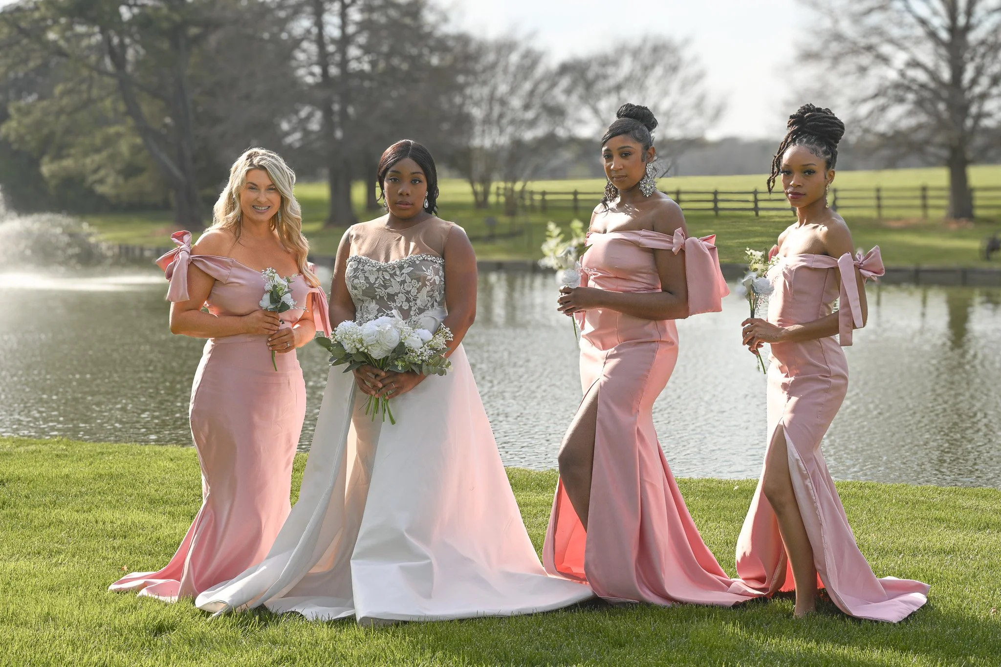 Beautiful bridal party portrait featuring bridesmaids in coordinated dresses walking together outdoors, capturing friendship and celebration, photographed in Rocky Mount, NC.
