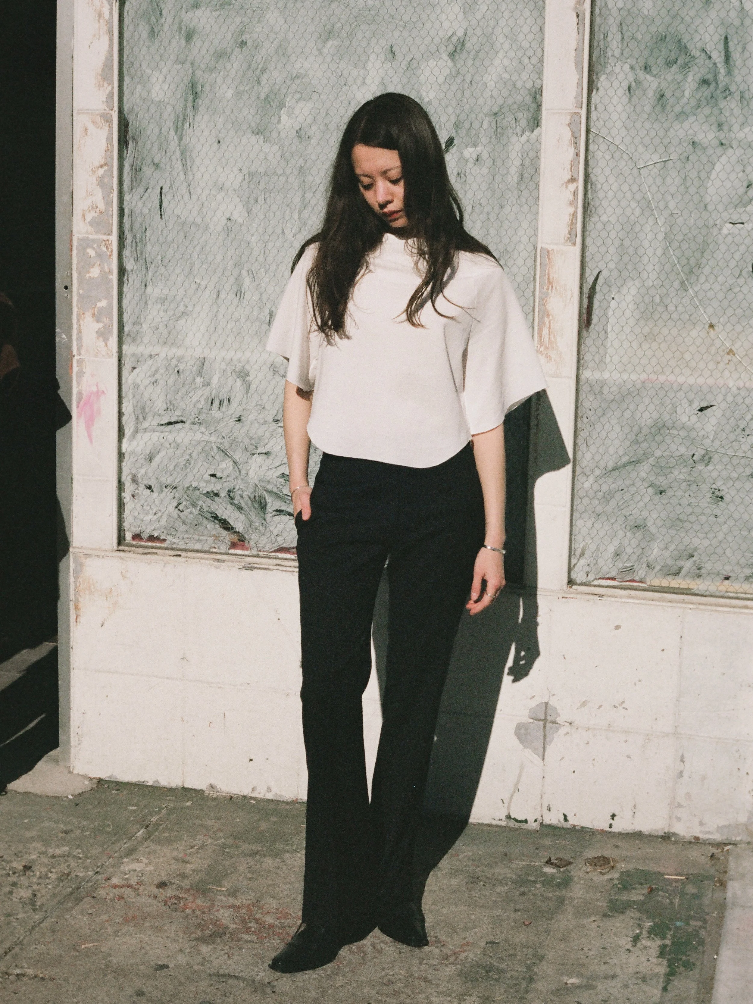 TROUSERS WITH EXPOSED CURTAIN