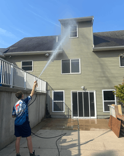 Adam from Lansing Precision Power-Wash hitting a 3rd story dormer with water from the ground!