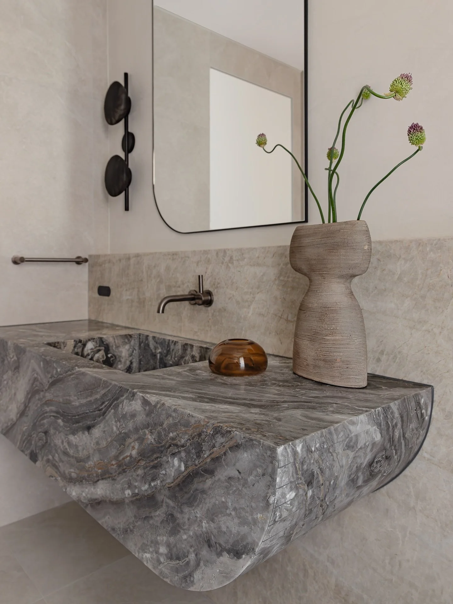A sculptural moment in the Elevare Residence powder room.
Natural stone, gentle curves, and thoughtful metal accents come together in quiet harmony — proof that small spaces can leave a lasting impression.
Interiors @nazdesignstudio.au
 
Shoot