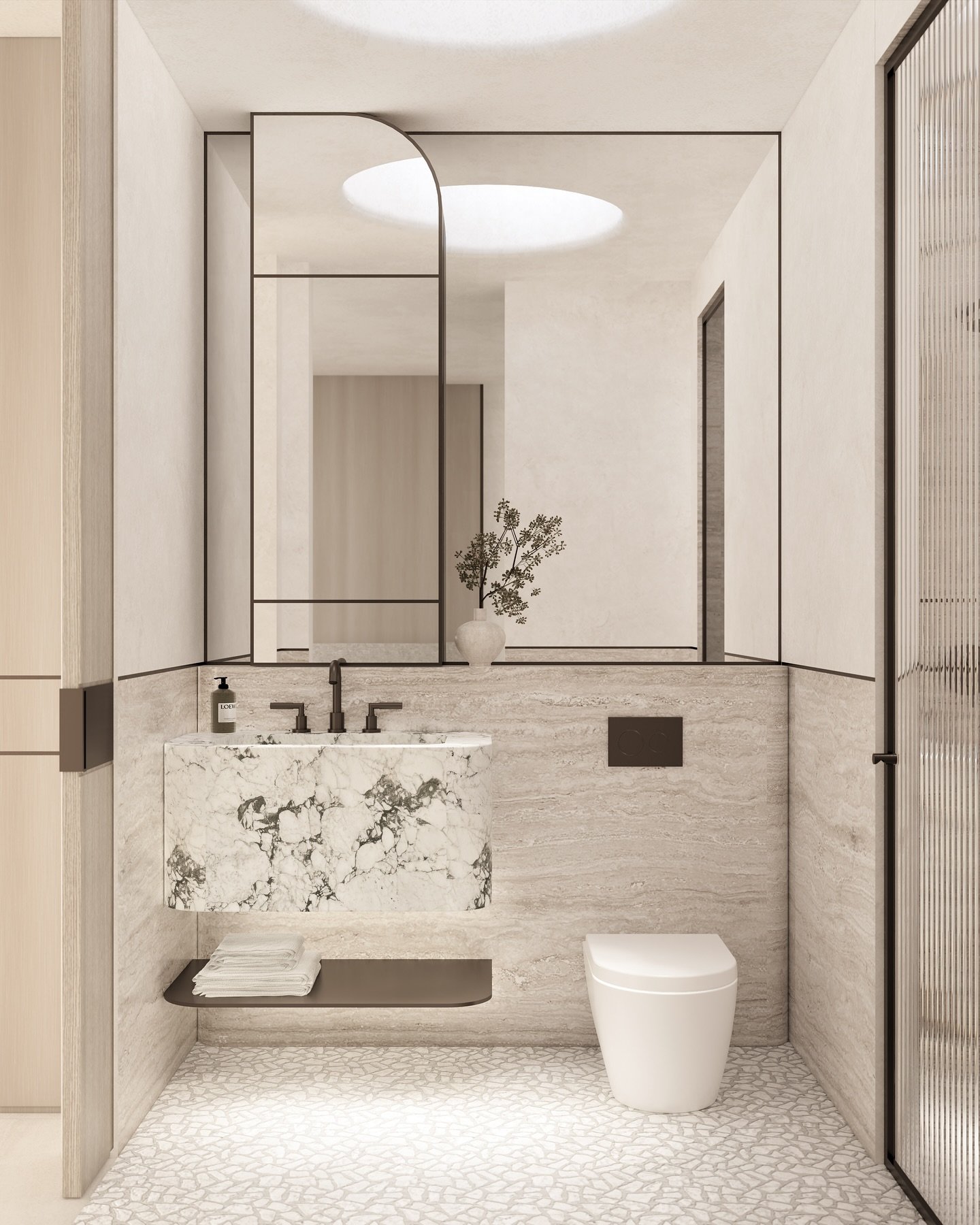 The Promenade Residence bathroom is shaped by balance and restraint. Travertine grounds the space with texture, while the marble basin introduces a bold natural pattern. A custom mirror cabinet design maximises light and creates a sense of openness,