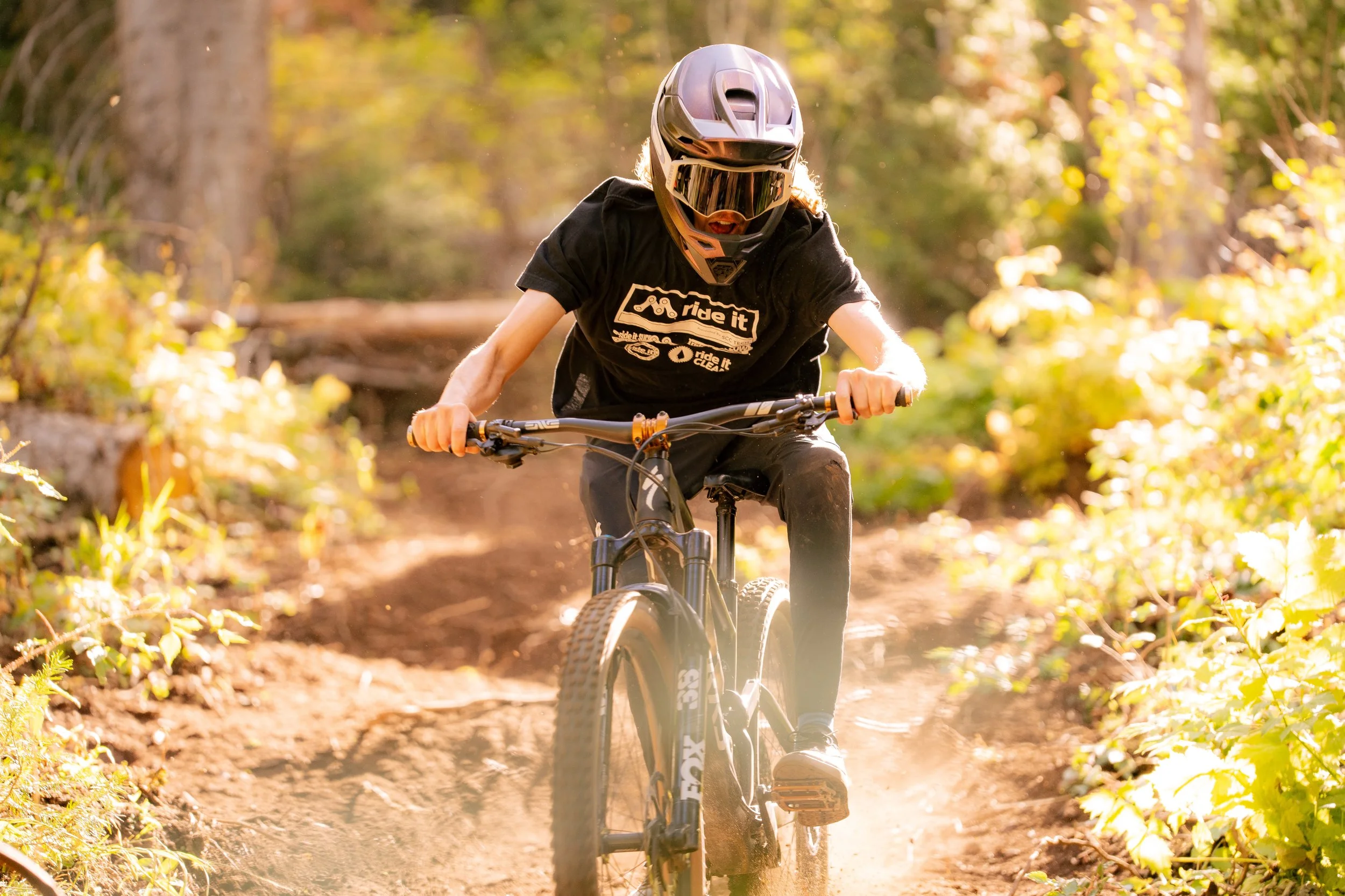 Person  riding a mountain bike on a forest trail | Photography by Anders Henrikson Photo 