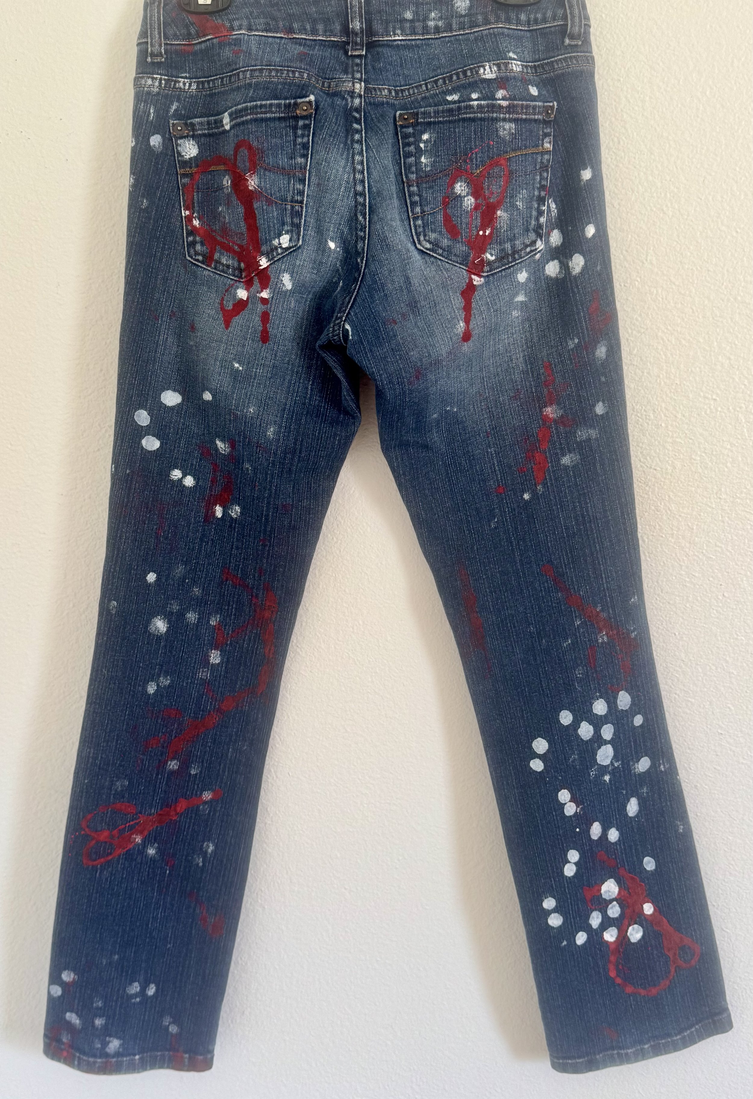 Back of jeans painted with dots and hearts.jpeg