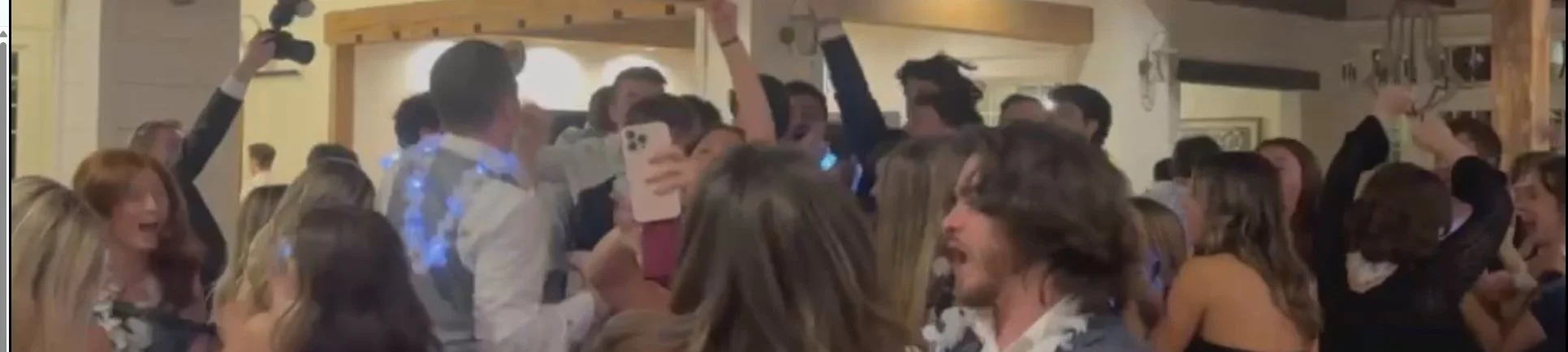 group of attendees jumping and celebrating enthusiastically at a Trey Triplicate performance