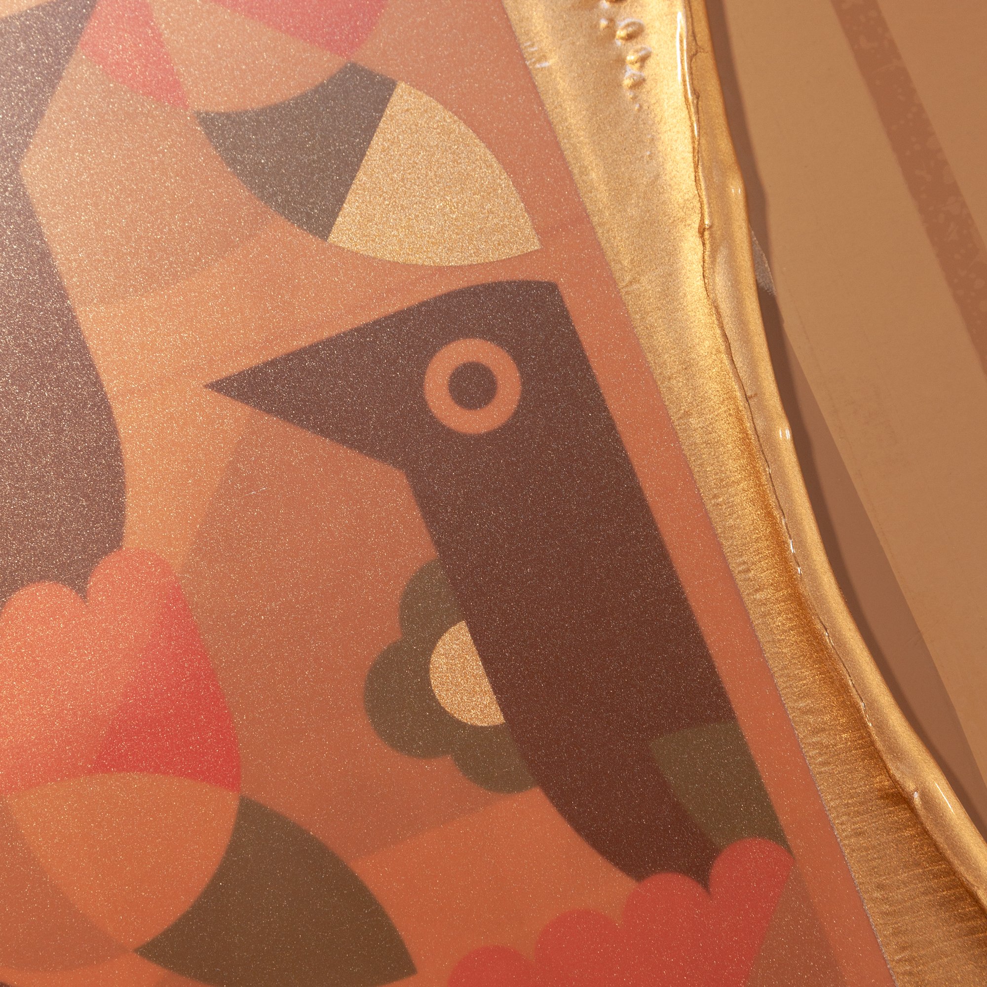 Closeup shot of work in progress by Jim Fox, with the gold ink on the screen.