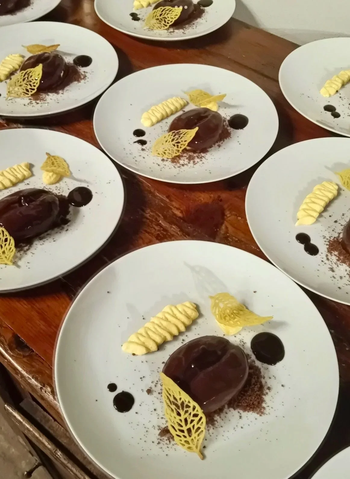 plates of tiramisu in the shape of a coffee bean