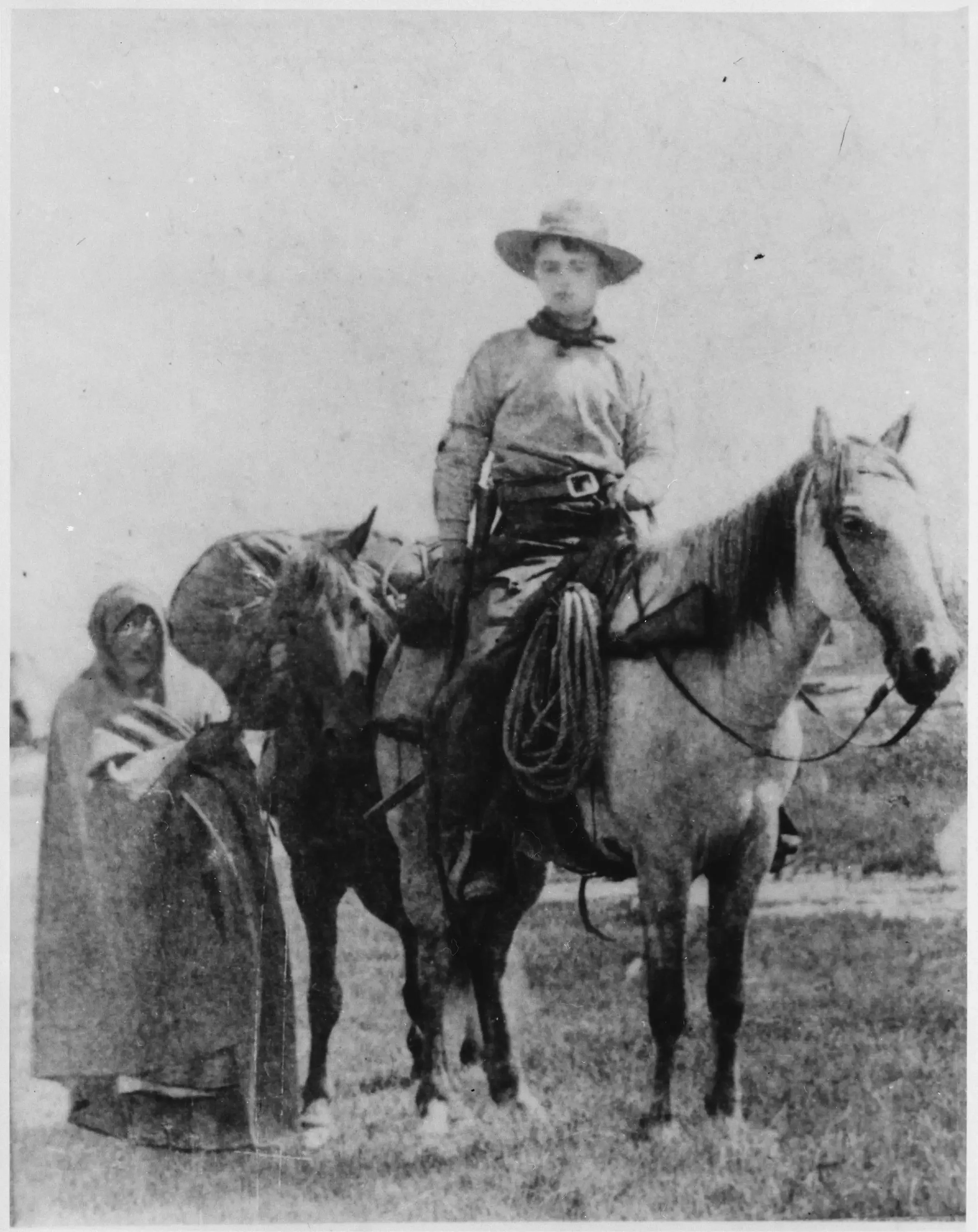 Historical photograph of a rider with horses illustrating Pony Express mail delivery