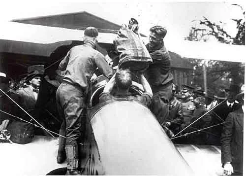 Historical black-and-white photograph of early airmail aviation