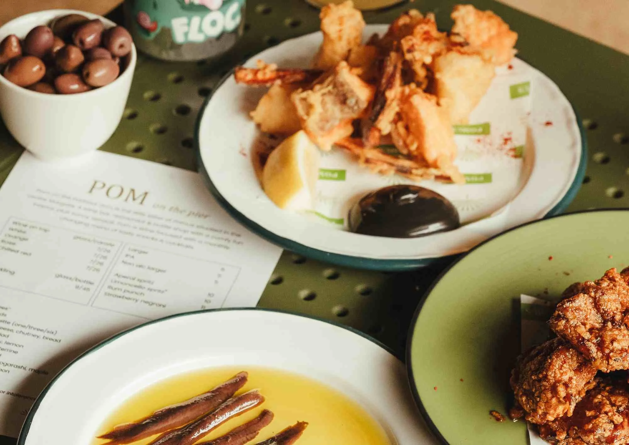 Close up of small plates on a green table
