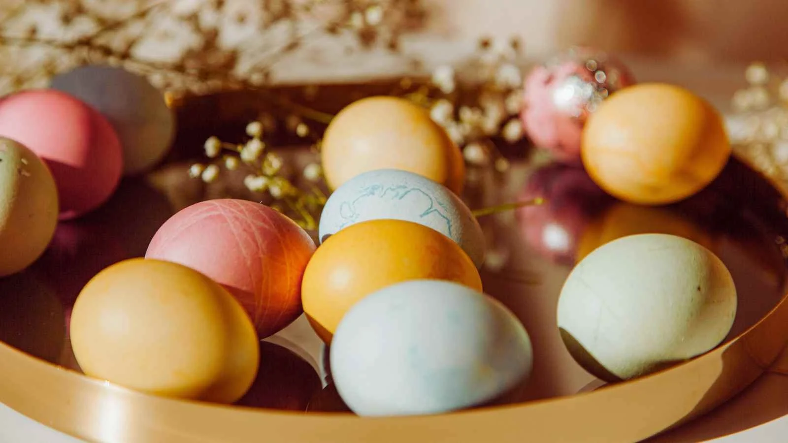 close up of pastel eggs in a bowl