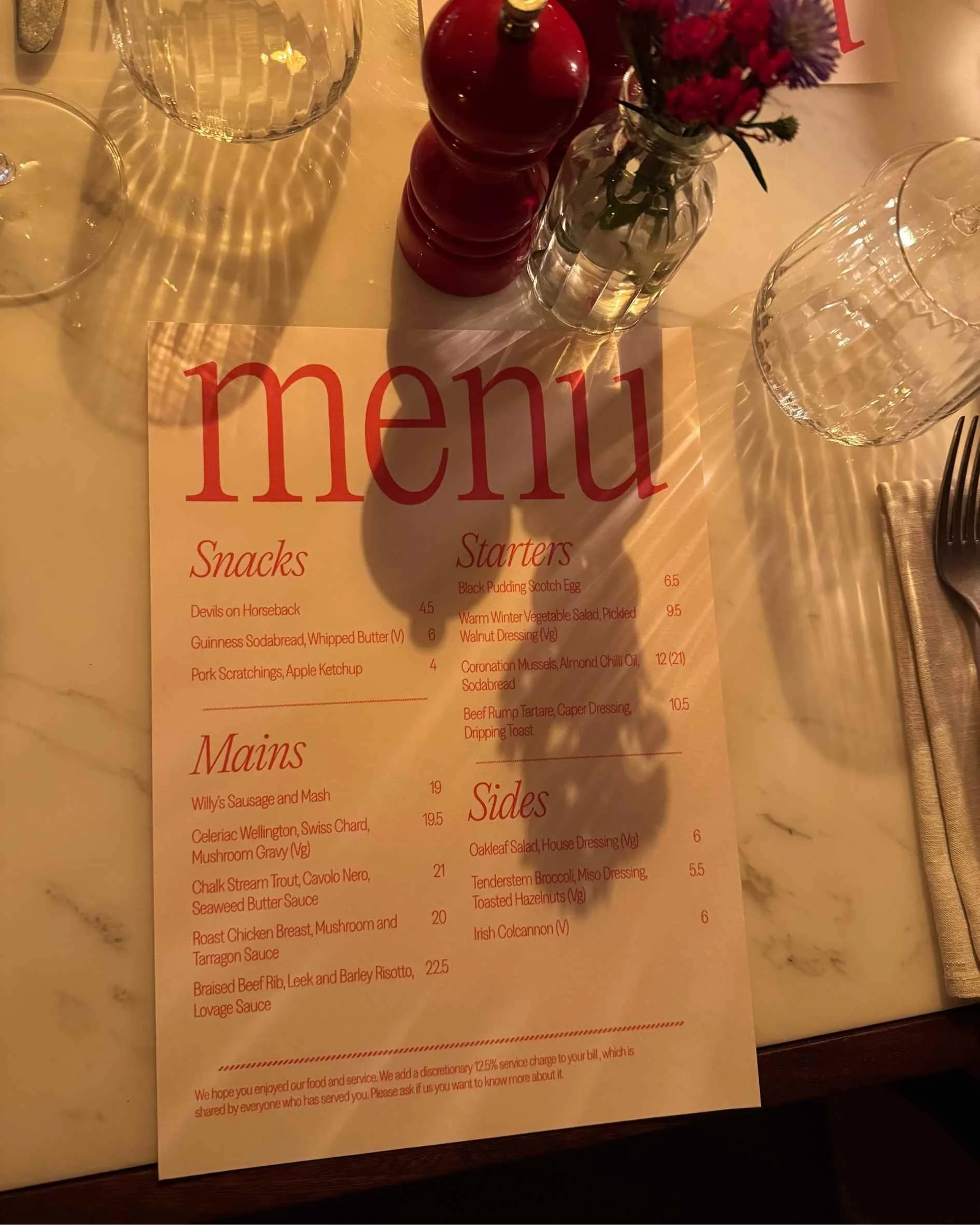 close up of willy's menu on a marble table