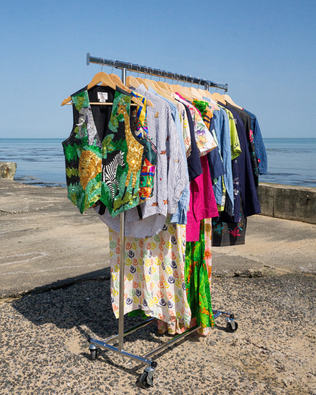 row of vintage clothes outside by the sea