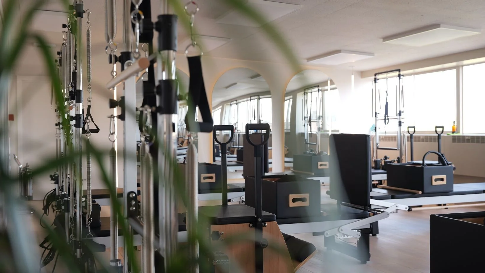 pilates reformer equipment in a light studio
