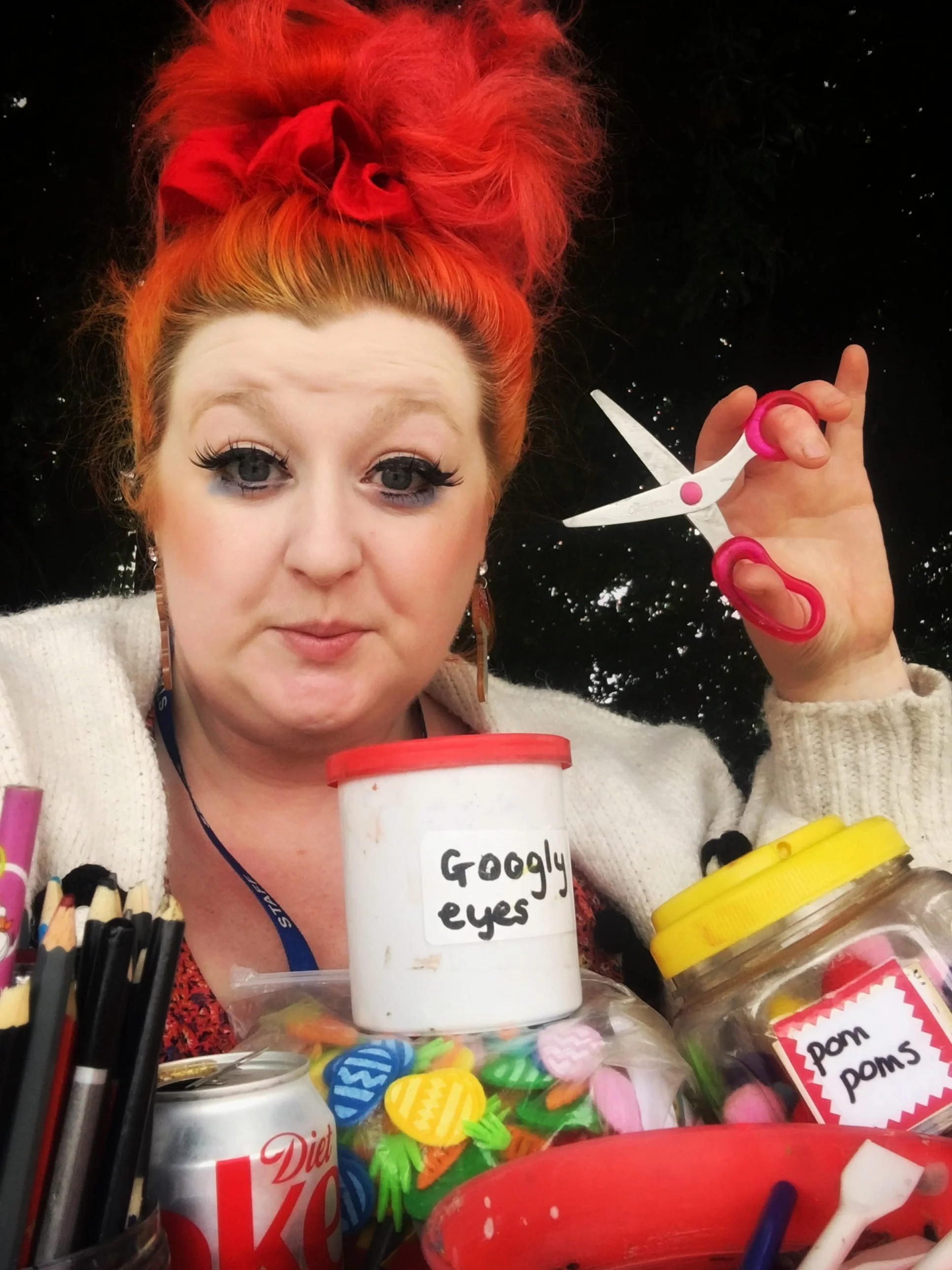 woman with pink hair and scissors