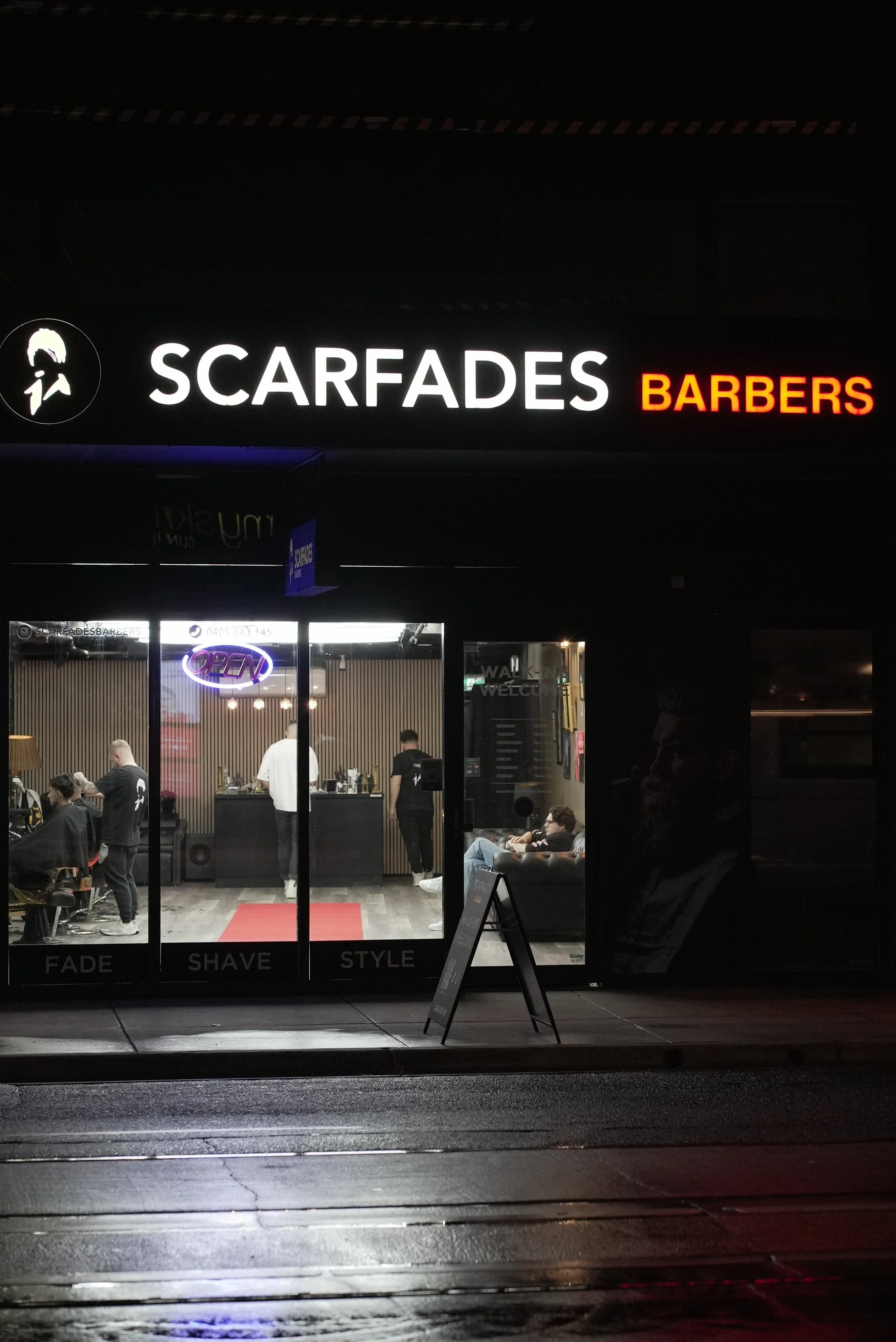 Scarfades Barbers shopfront on High Street in Northcote, Melbourne