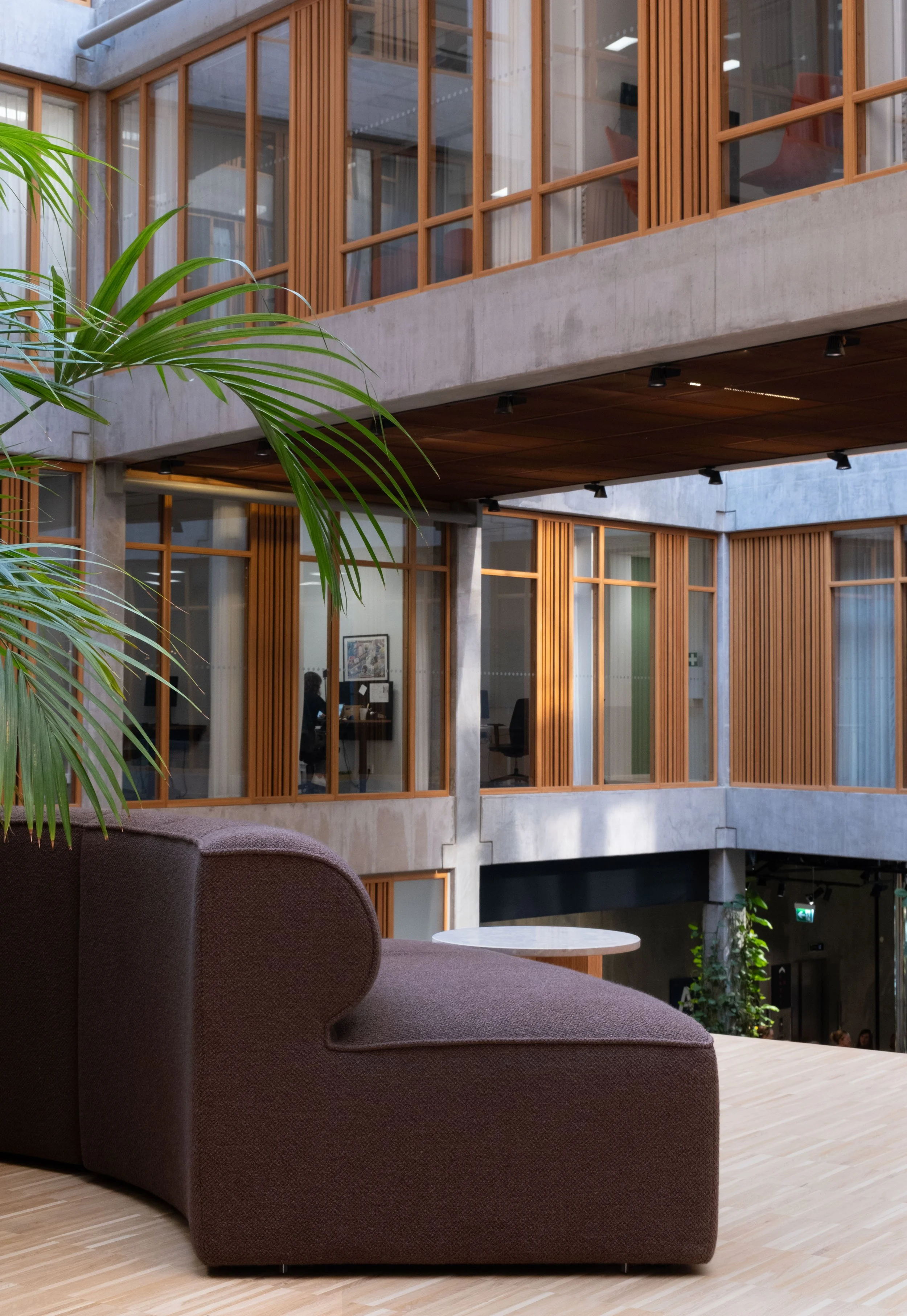 Lounge area in an open workspace with earthy tones