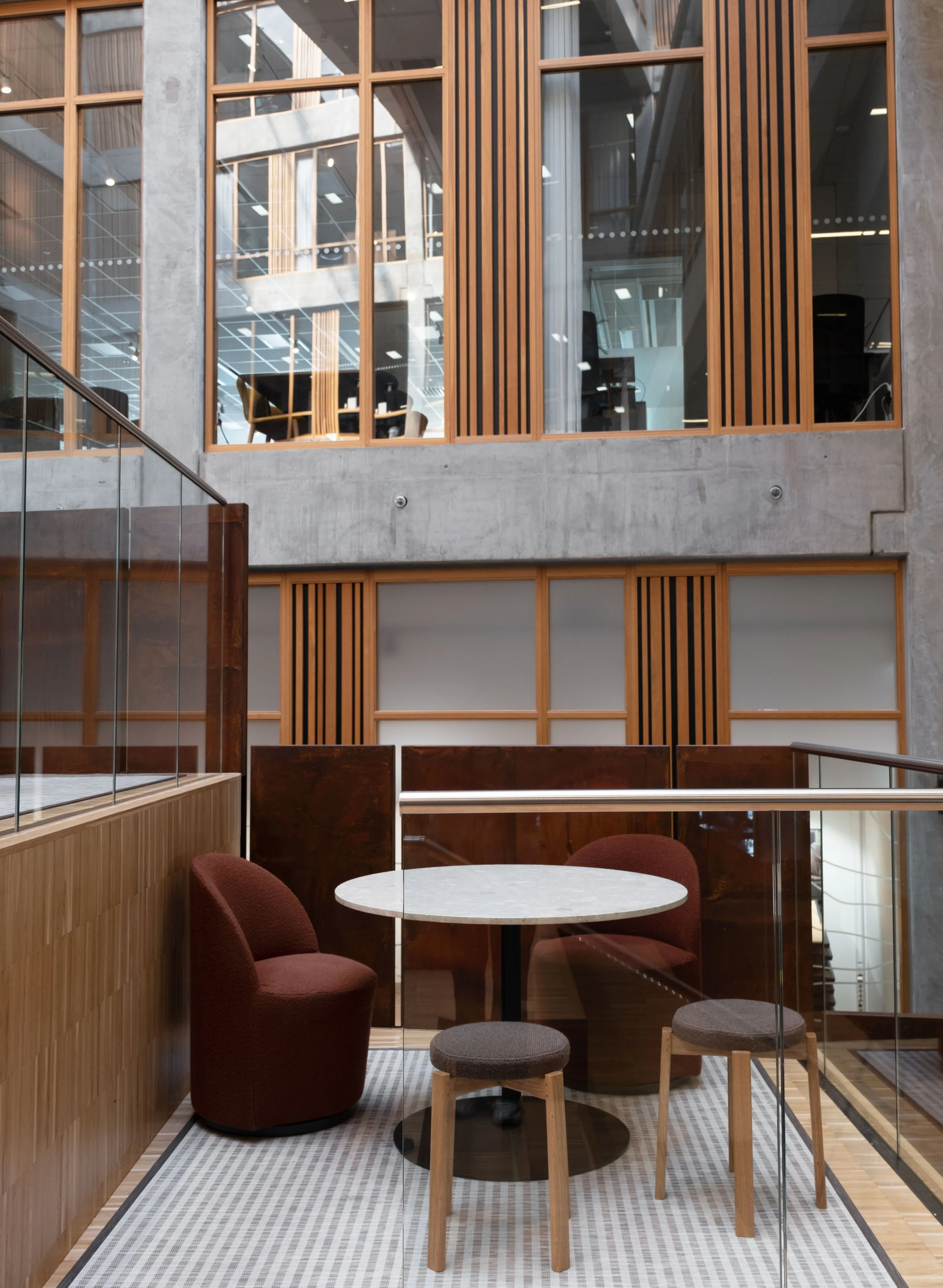 Social meeting area with warm materials and flexible seating