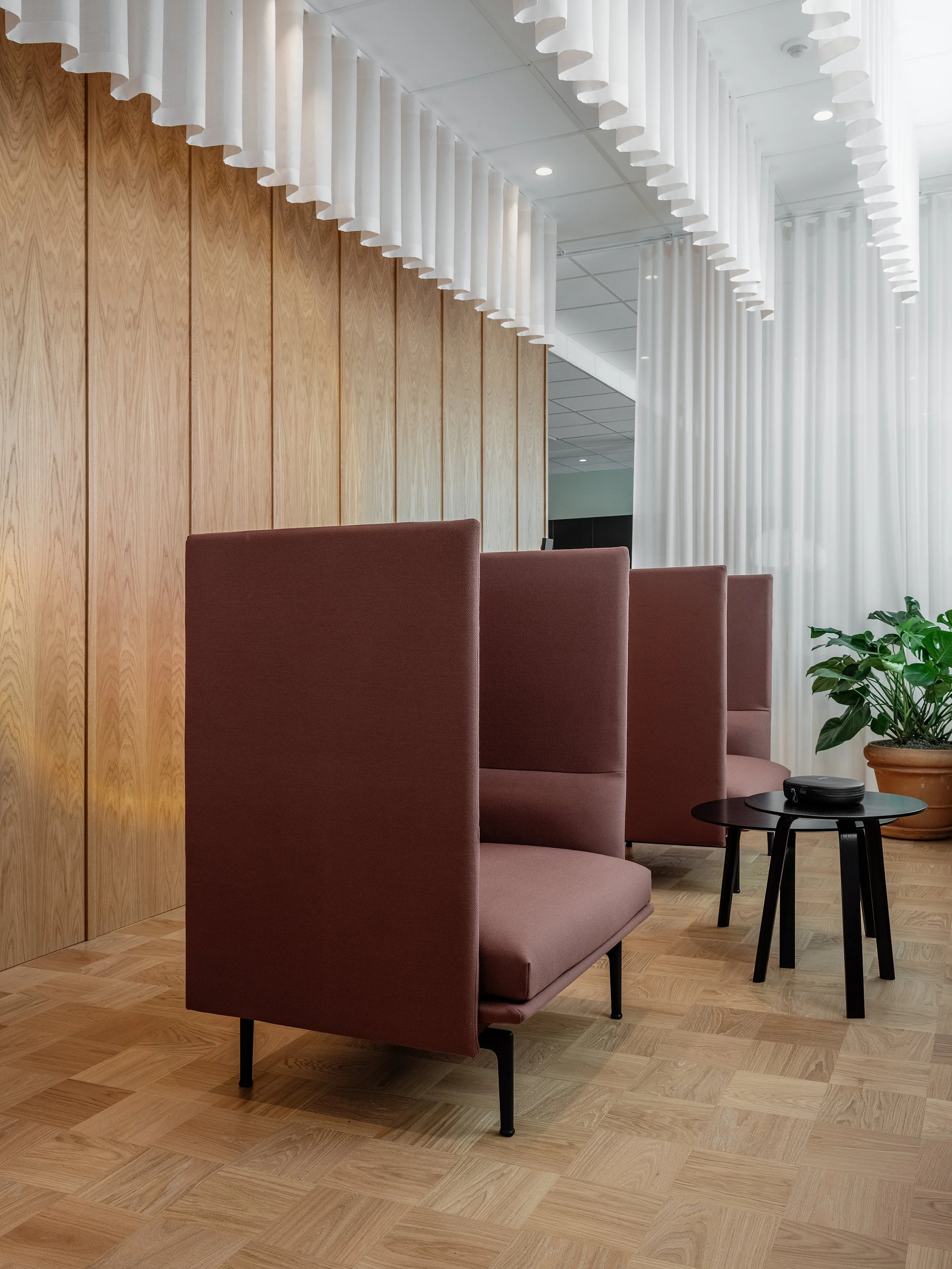 Zen Zone with high-backed seating, curtains and soft lighting for focus and recovery