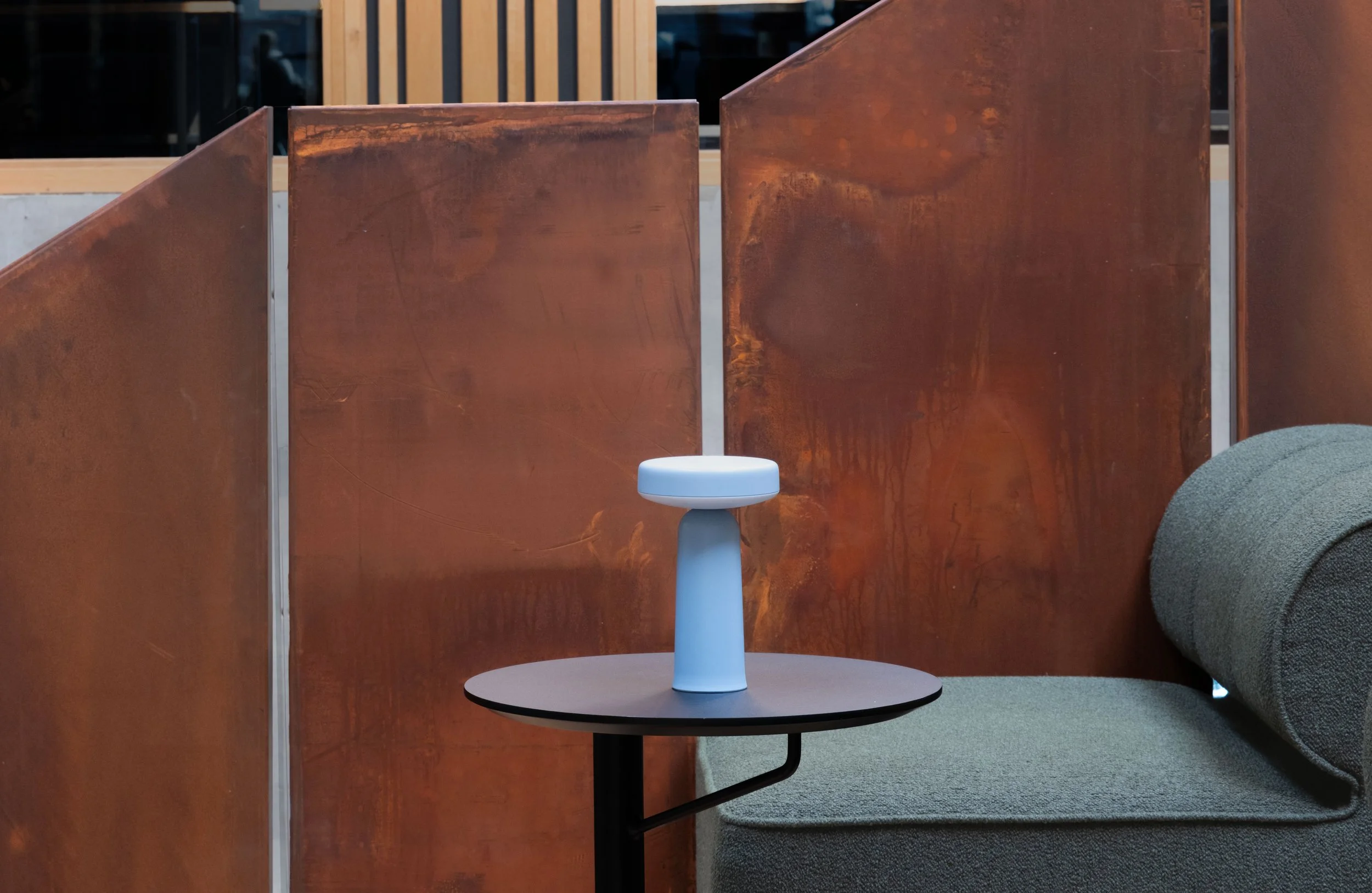 Detail view of seating with warm materials and soft shapes