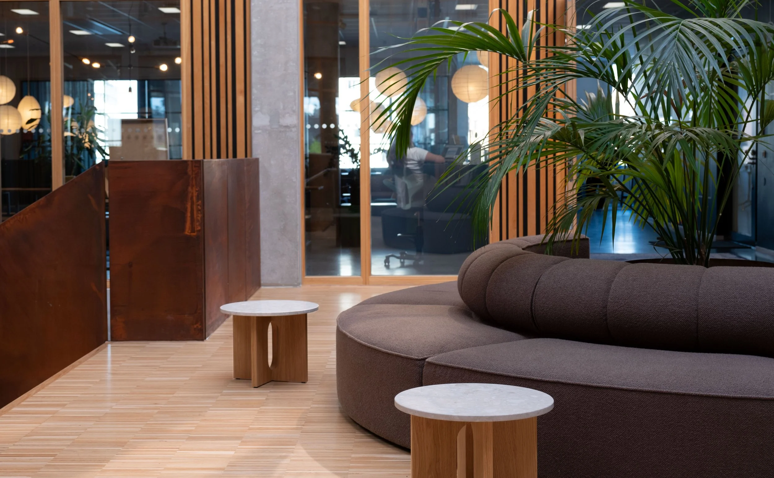 Social lounge area with soft shapes and earthy tones