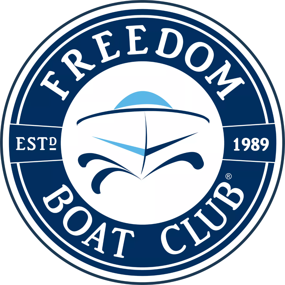 Friedom Boat Club logo, featuring a stylized boat with a sail and water design, with text "FREEDOM BOAT CLUB," established 1989.