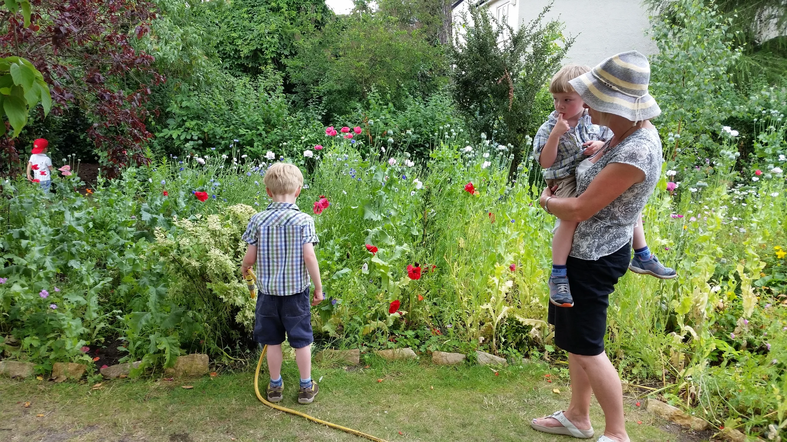 Cath cuddle watering.jpg