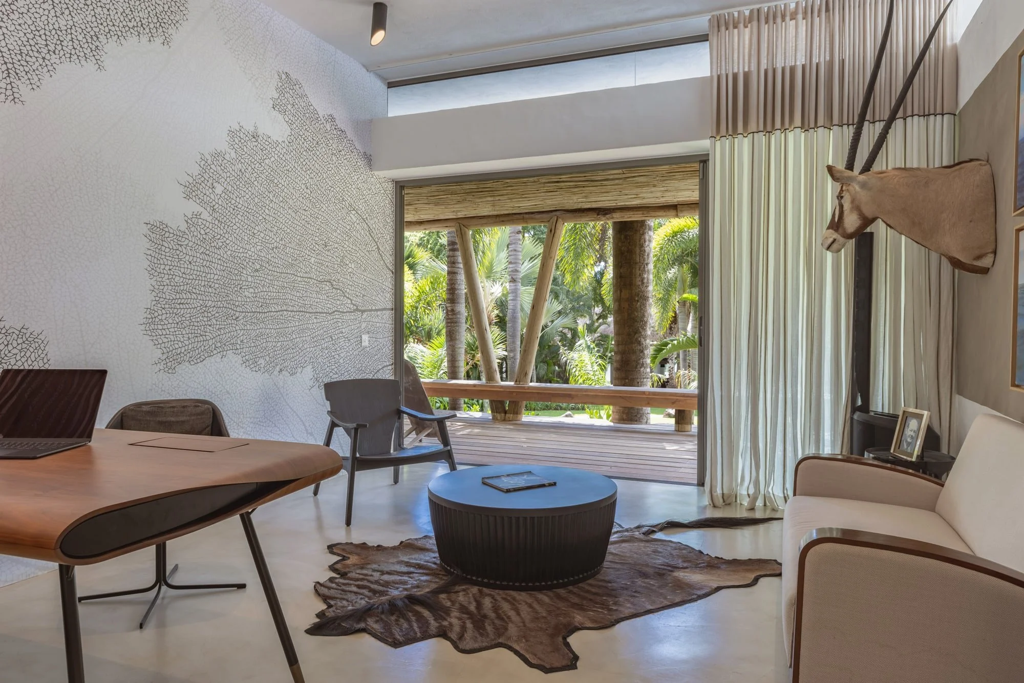 Private home office with bespoke desk and tropical garden view