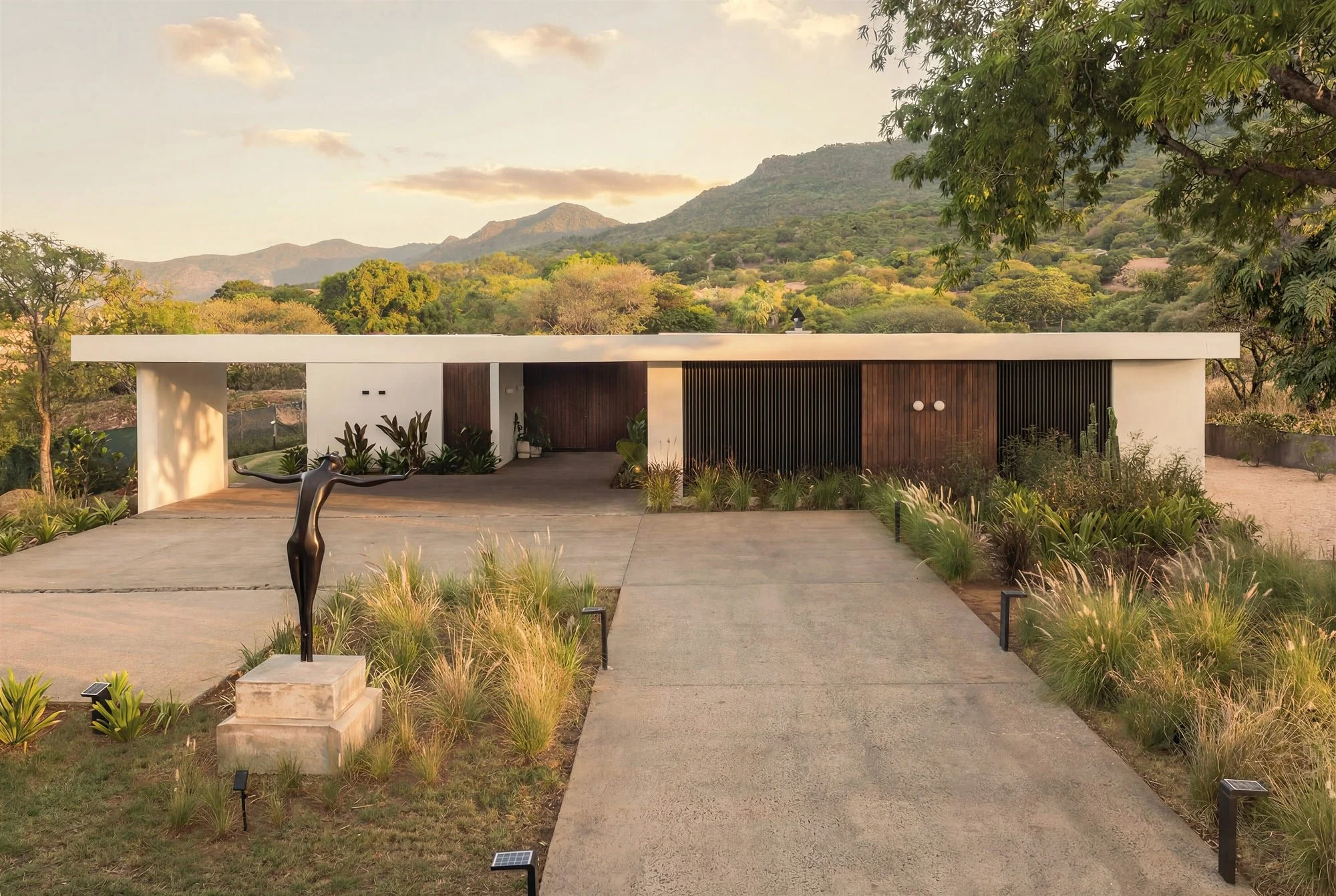 Krono Residence entrance driveway with mountain views in Mauritius