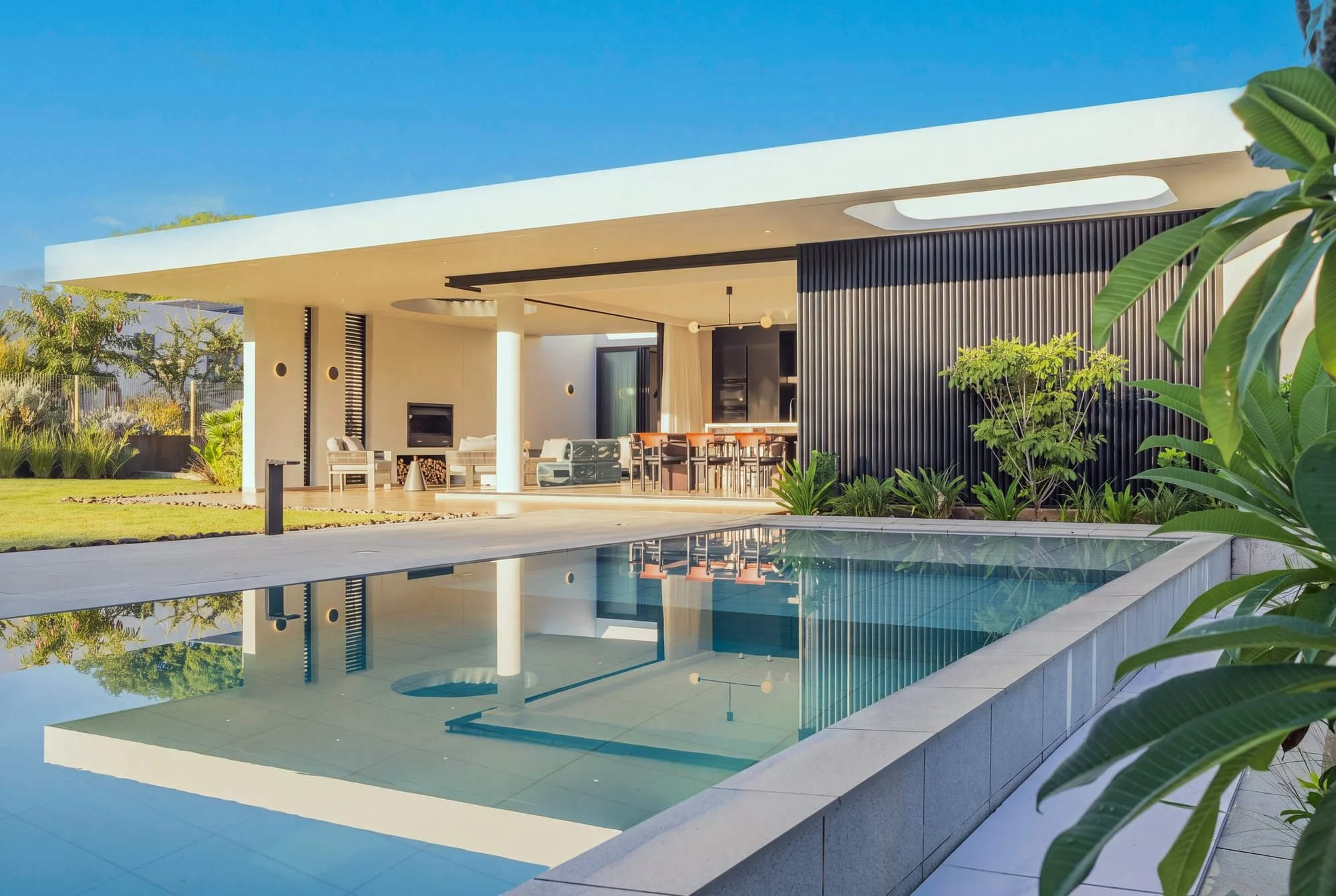 Pool reflection and open terrace at Krono Residence