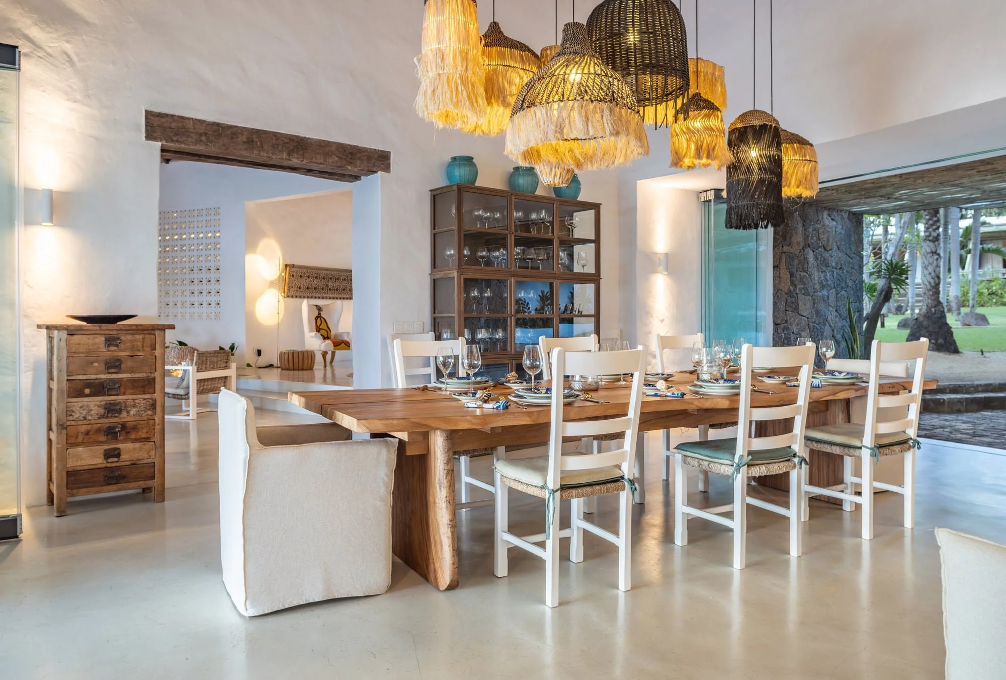 Dining room with woven pendant lights and bespoke timber furniture
