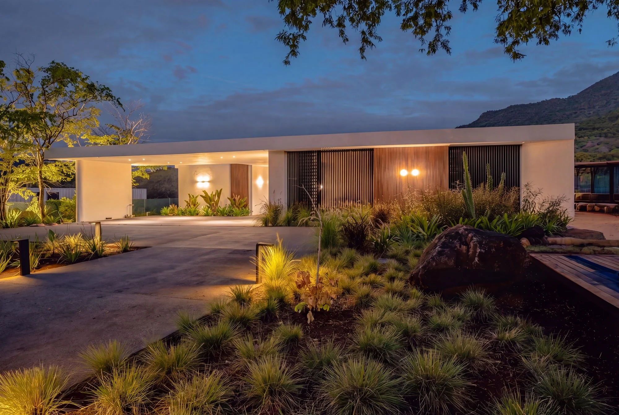 Krono Residence front facade illuminated at dusk