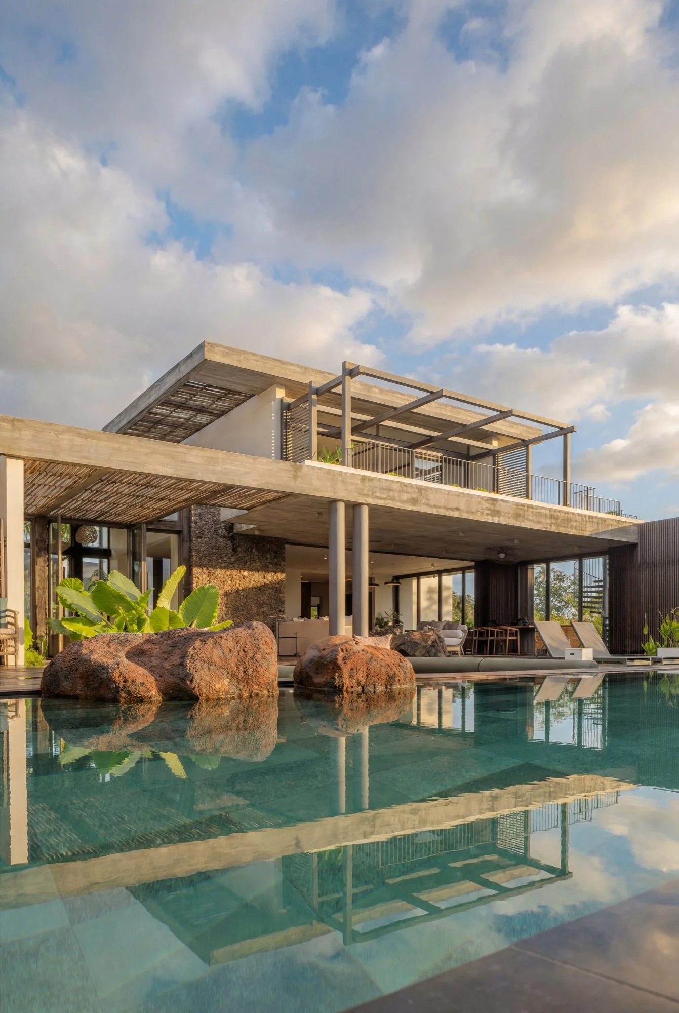 Open plan villa living area with tropical resort atmosphere