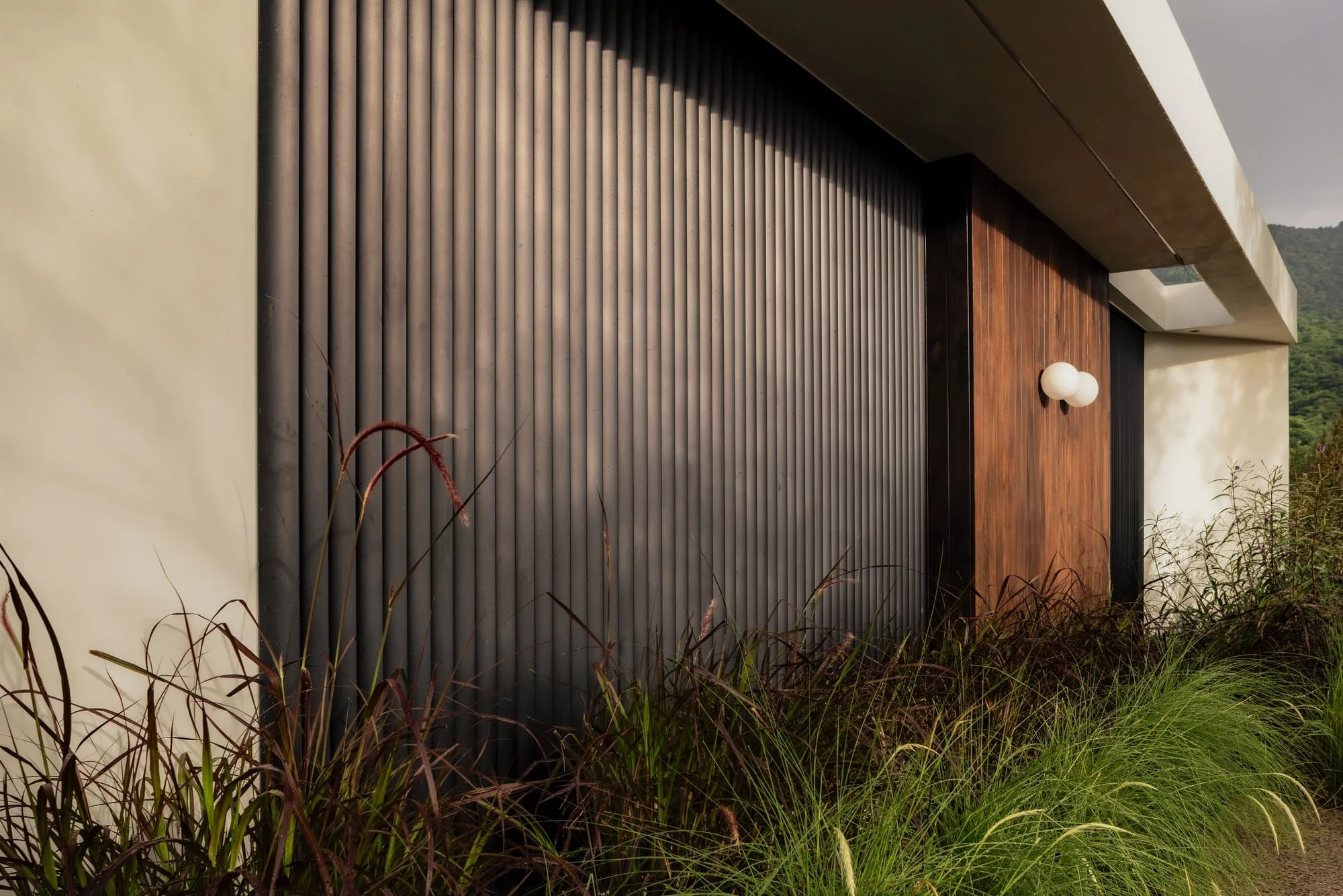 Black timber facade detail at Krono Residence