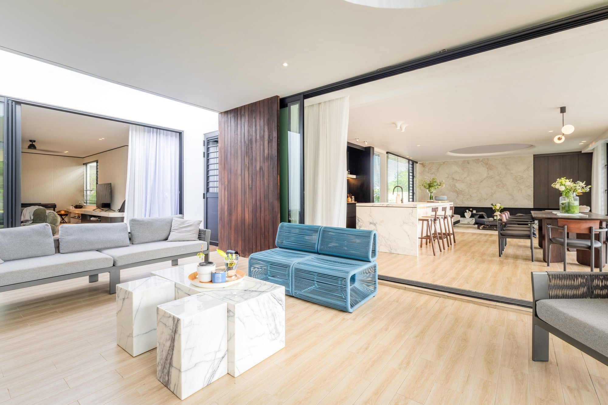 Covered terrace opening onto the living spaces at Krono Residence