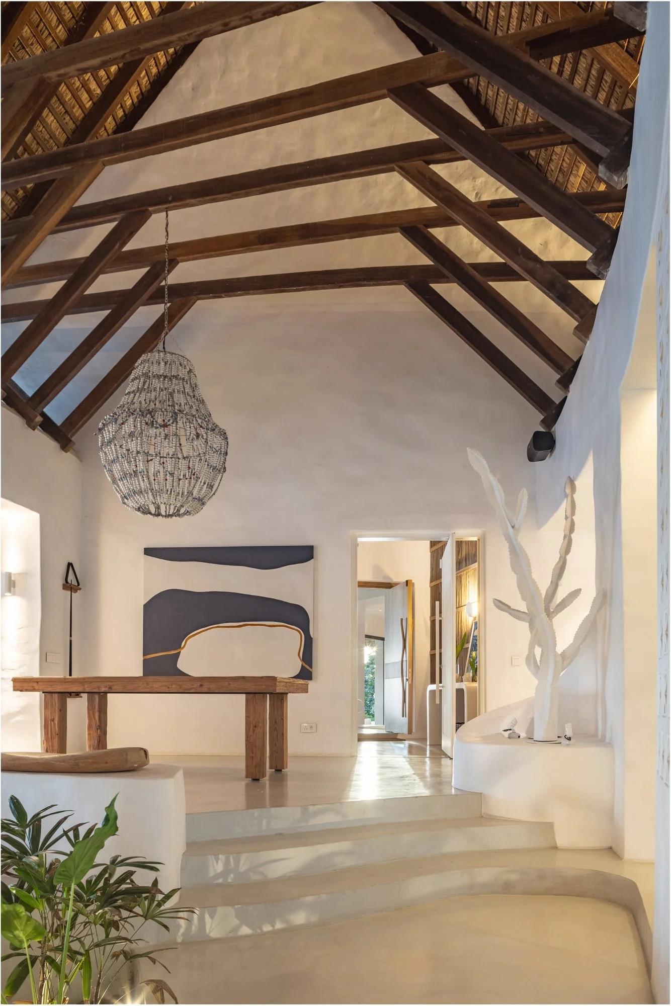 Vaulted gallery hall with contemporary art and timber roof structure