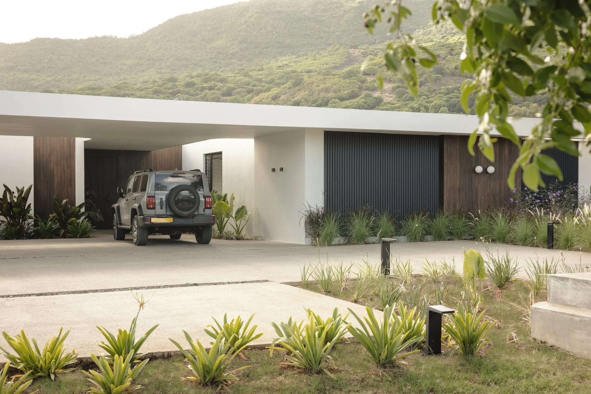 Front facade and landscaped carport at Krono Residence