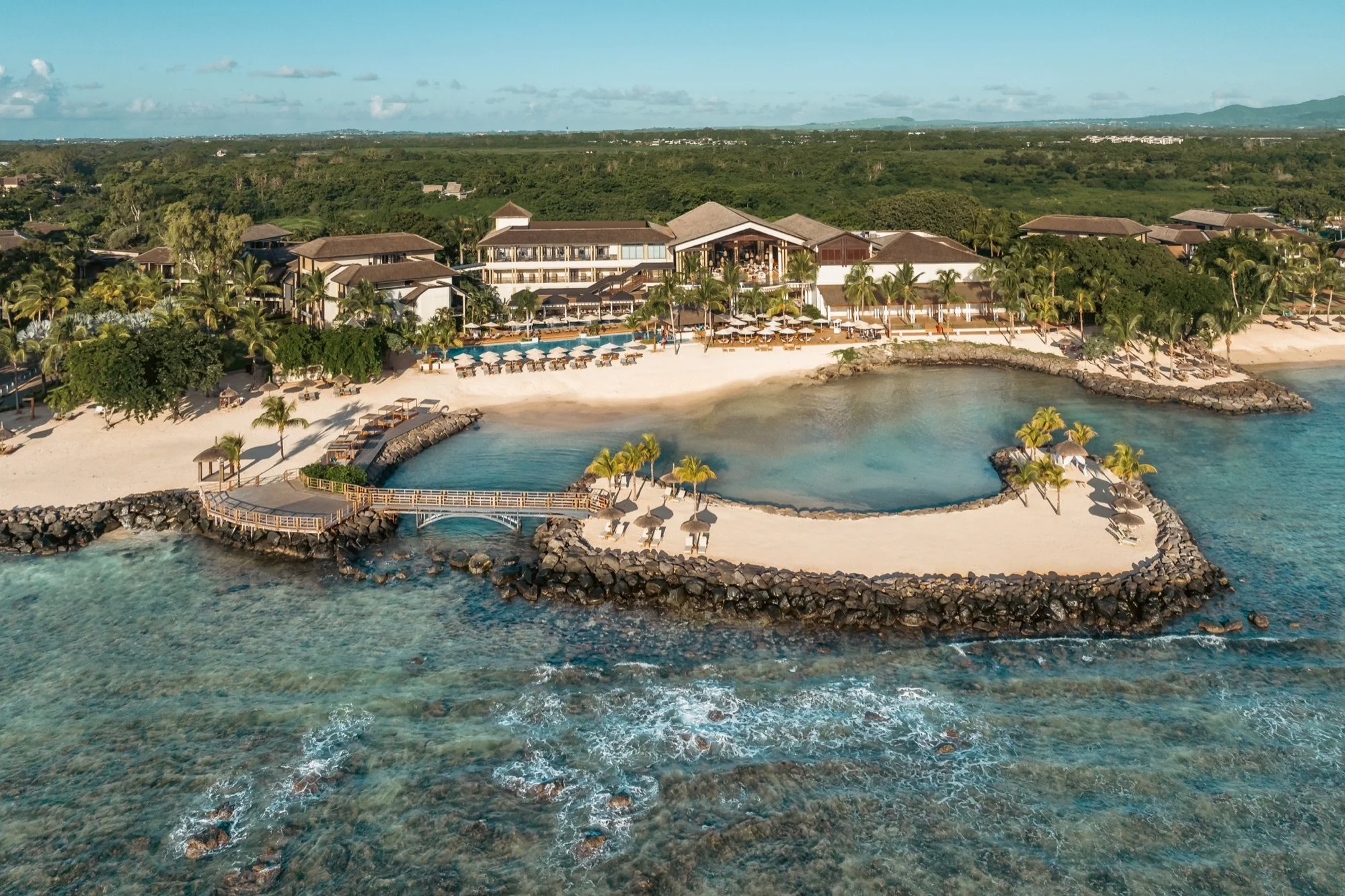 Resort exterior view with tropical landscape and architectural details