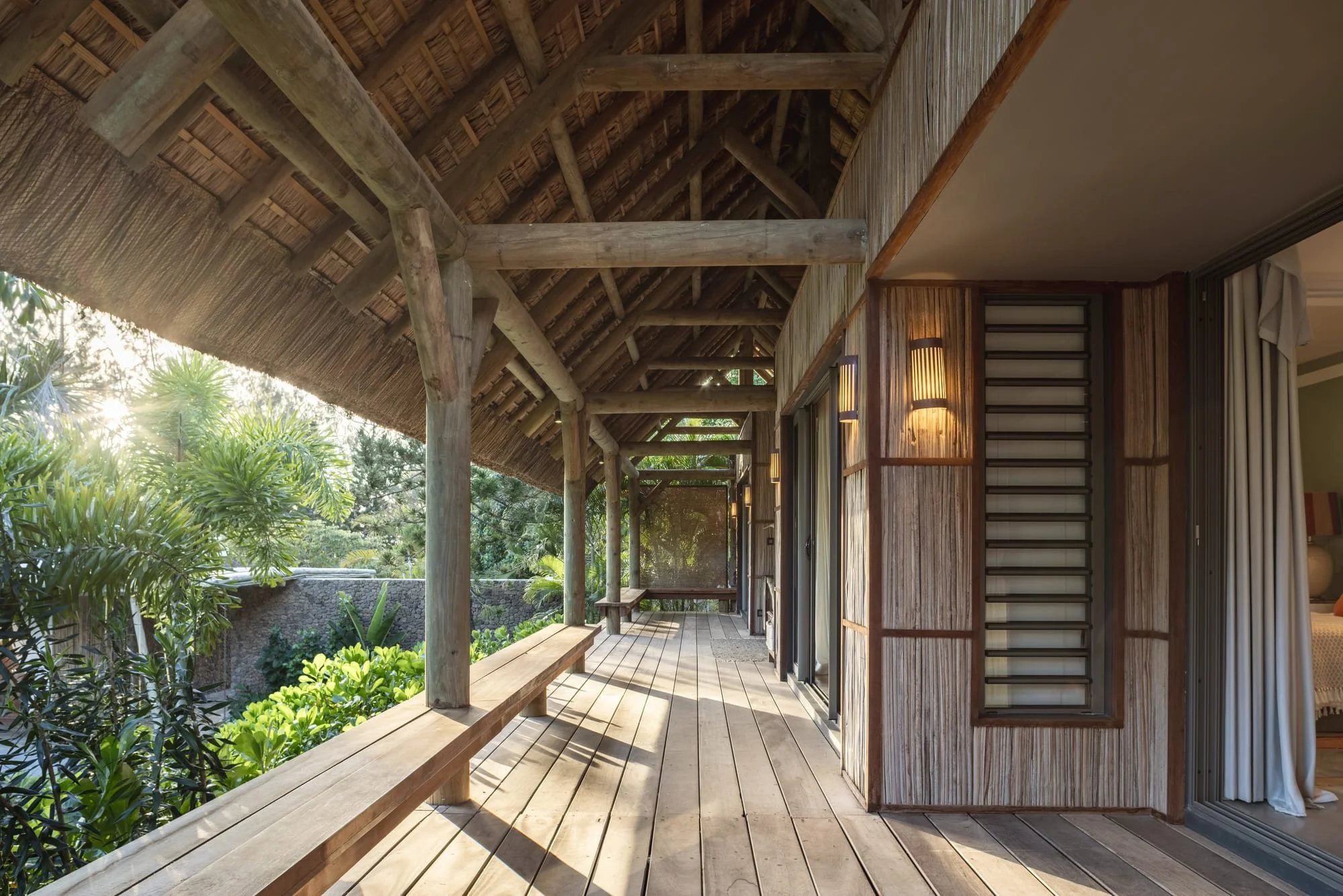 Shaded timber veranda connecting the private bedroom pavilions