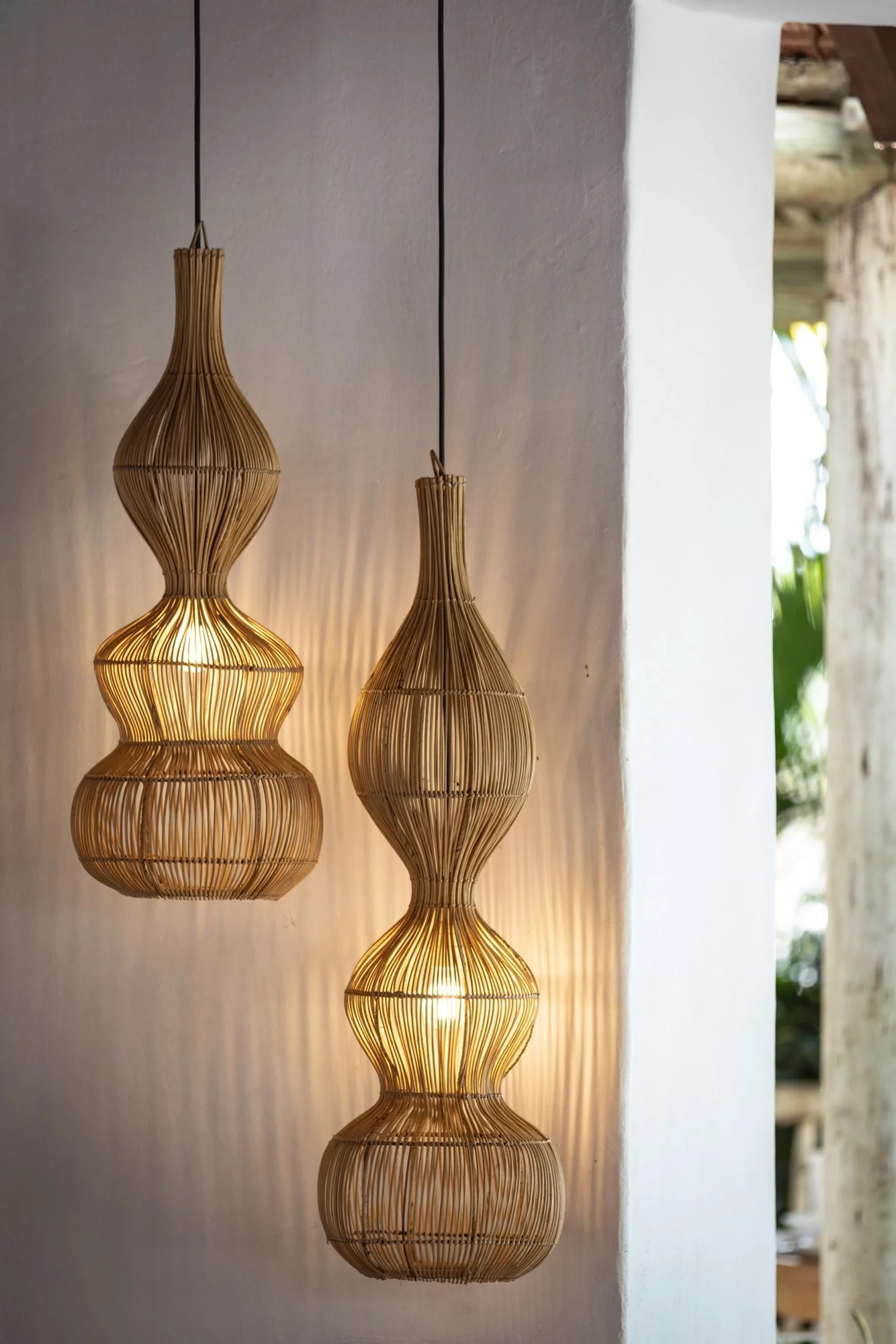 Handwoven pendant lights adding texture to a refined villa interior