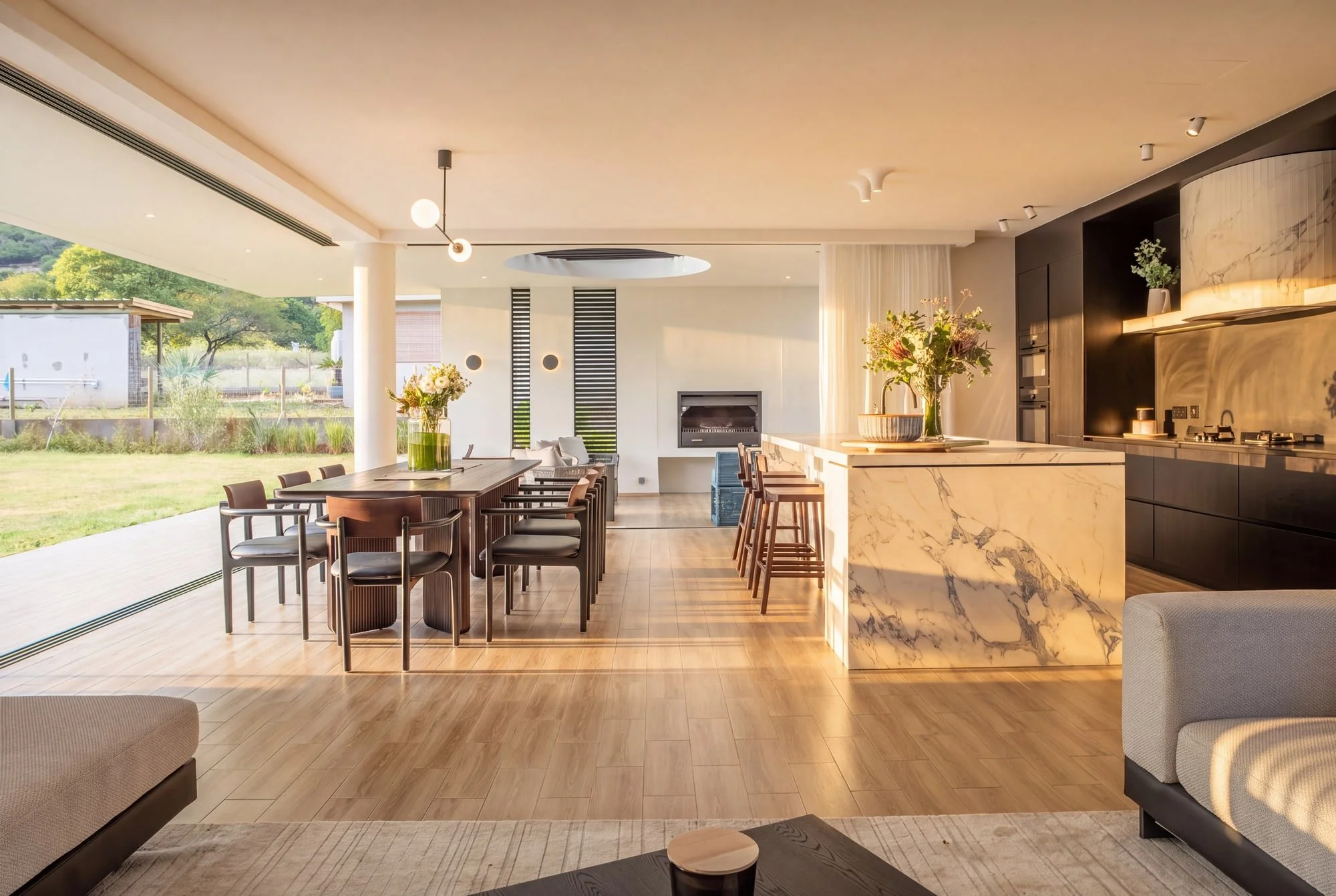 Open-plan kitchen dining and living area at Krono Residence