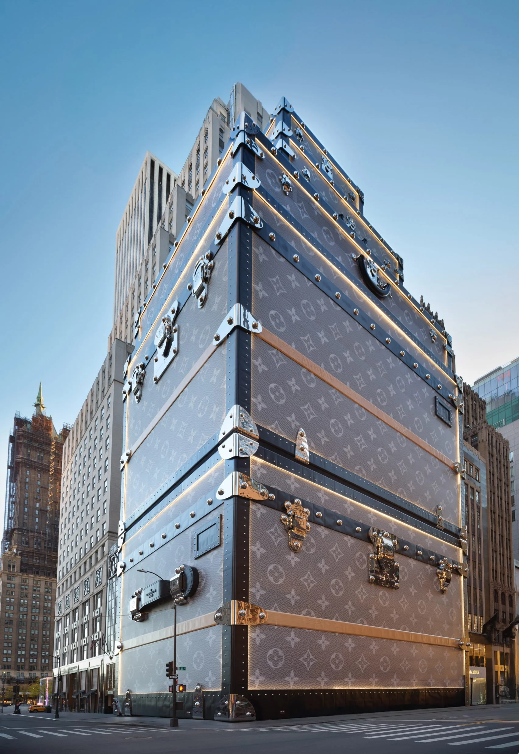  Zehavi, Ricky. Photograph of Louis Vuitton luggage-disguised flagship.  Dezeen , 18 Nov. 2024. 