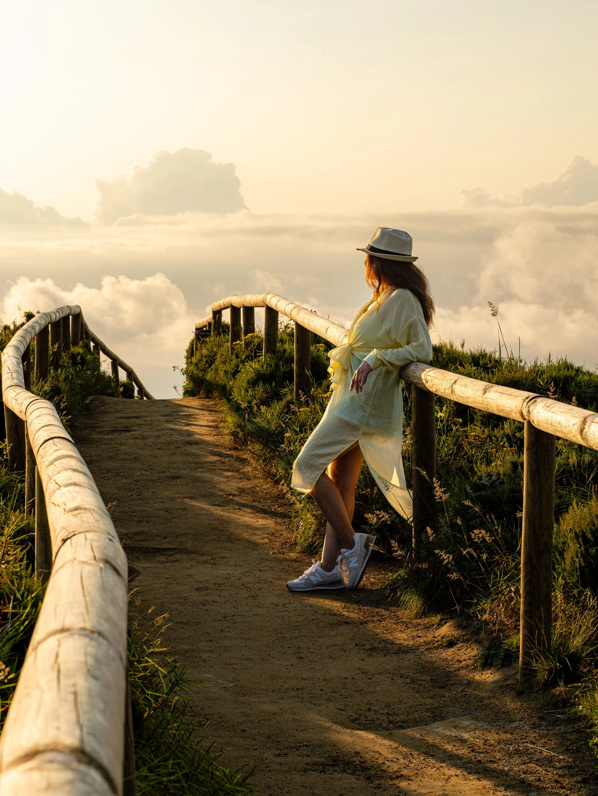 Solo traveler enjoying sunset views above the clouds in São Miguel Island, Azores during a private photo tour with a local Azores photographer