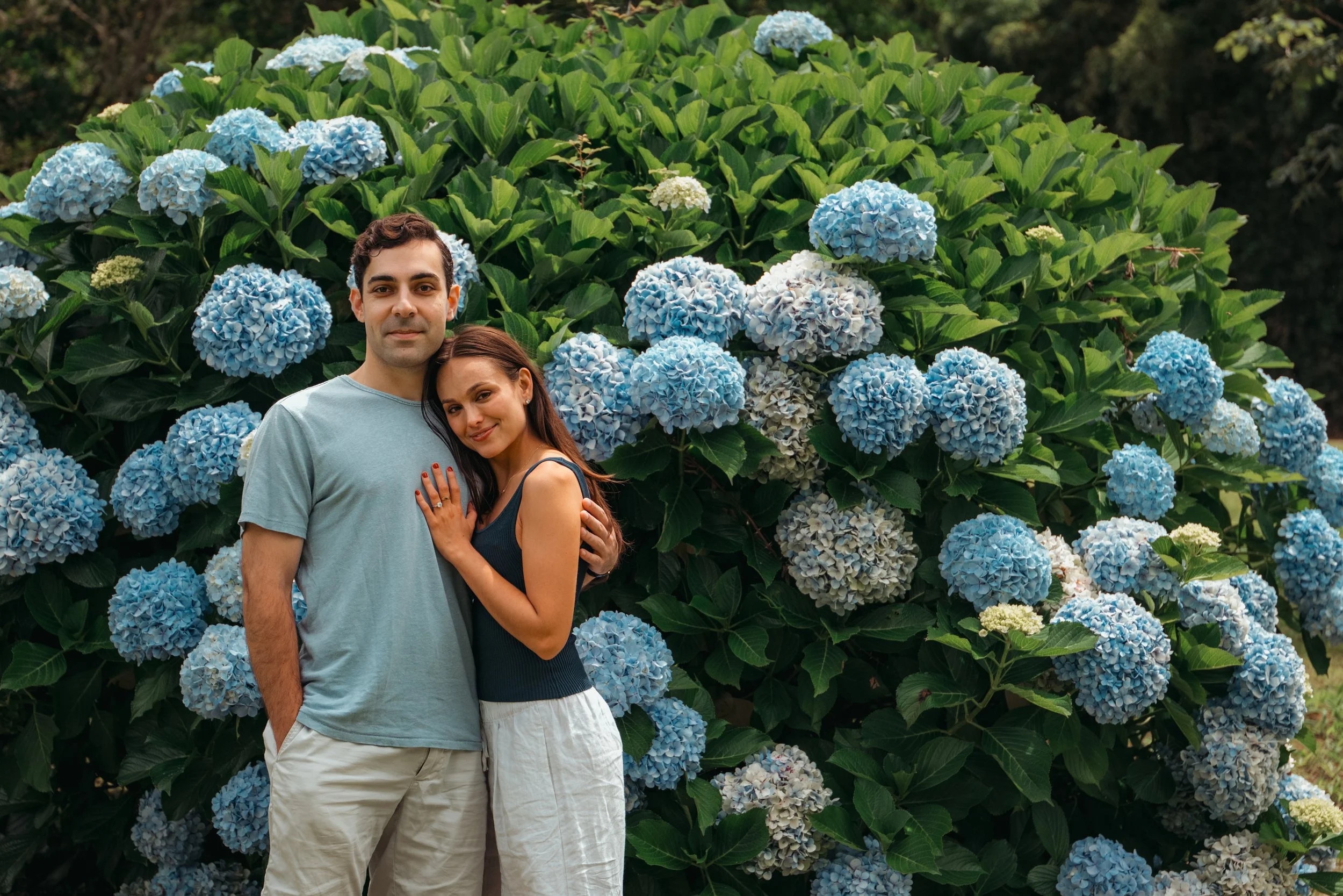 Couple portrait session surrounded by blue hydrangeas in São Miguel Azores