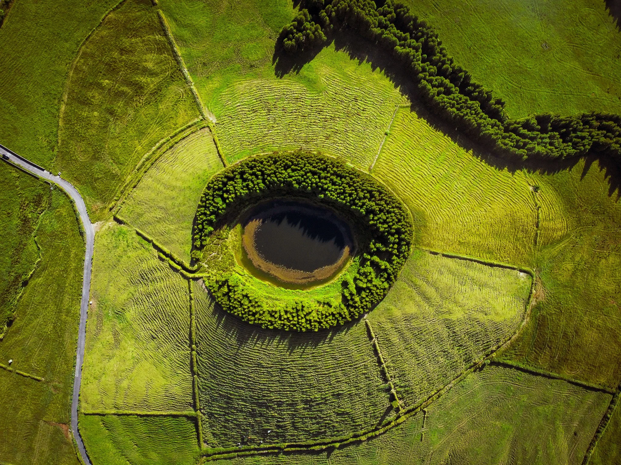 Aerial drone view of a volcanic crater in São Miguel, a top location for an Azores photography tour and travel photoshoot.